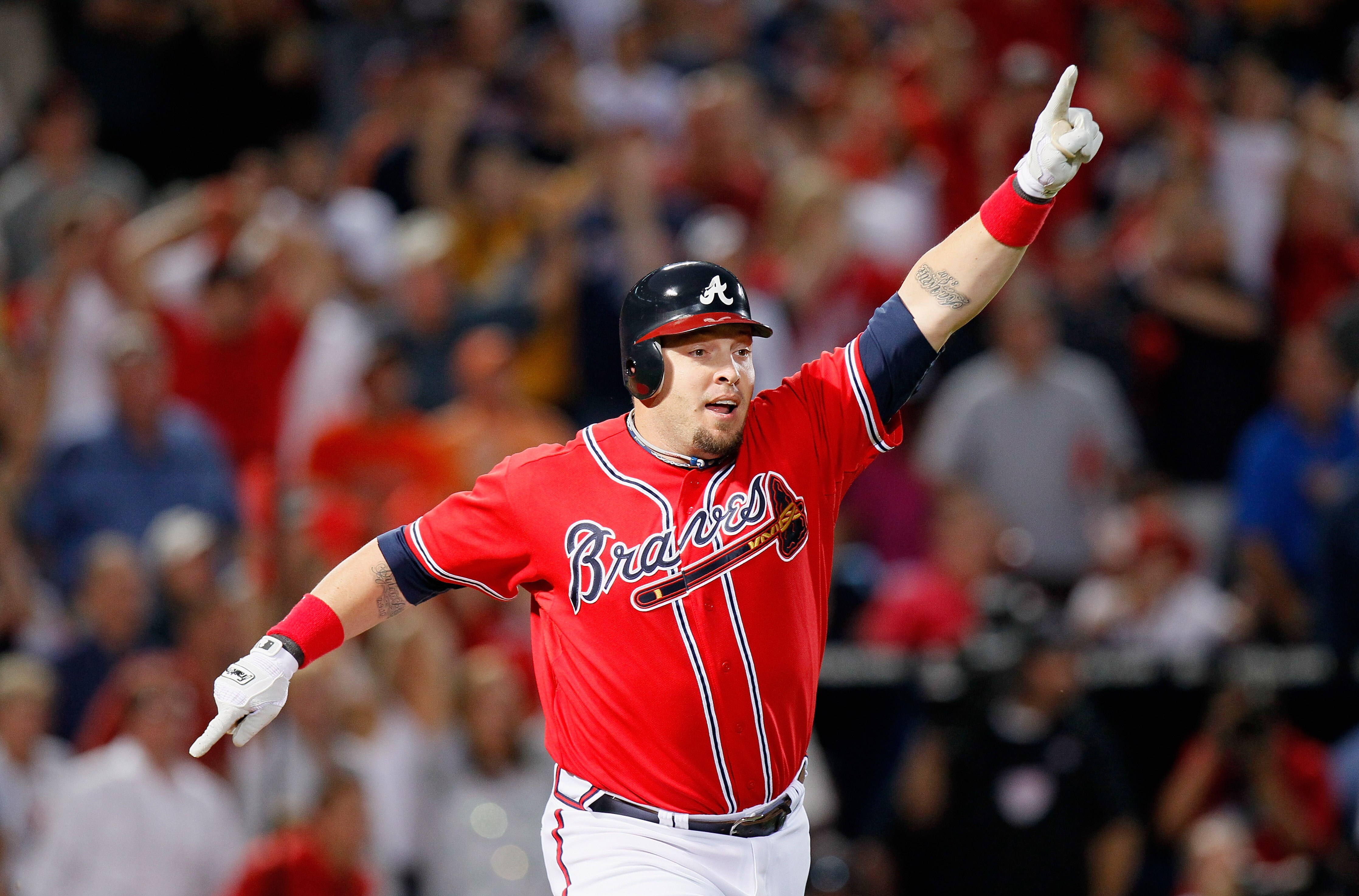 ATLANTA - OCTOBER 10:  Eric Hinske #20 of the Atlanta Braves reacts after hitting a two-run homer in the eighth inning off pitcher Sergio Romo #54 of the San Francisco Giants during Game Three of the NLDS of the 2010 MLB Playoffs at Turner Field on Octobe