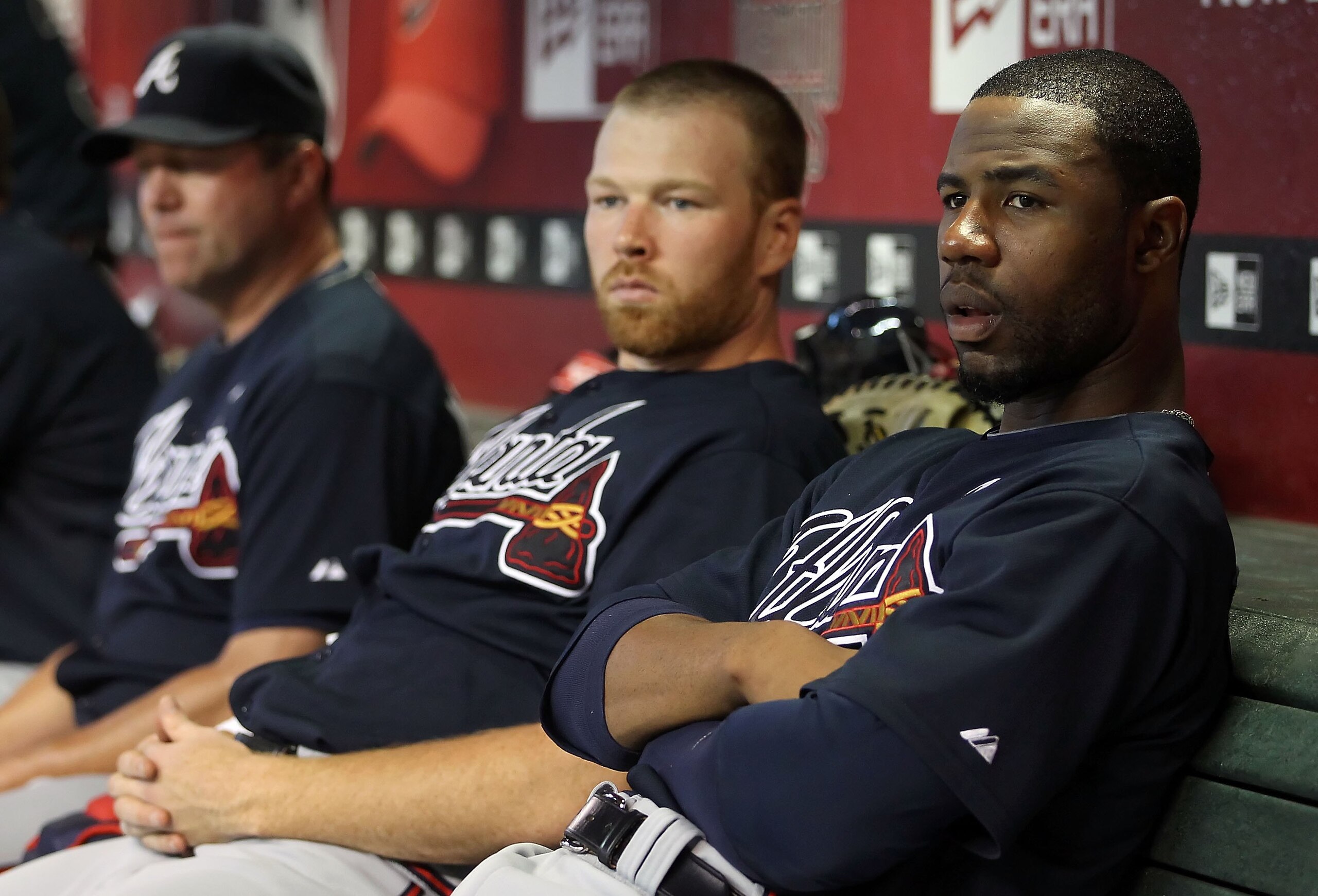 PHOENIX - JUNE 10:  Jason Heyward #22 (R) and pitcher Tommy Hanson #48 of the Atlanta Braves sit in the dugout during the Major League Baseball game against the Arizona Diamondbacksat Chase Field on June 10, 2010 in Phoenix, Arizona.  The Braves defeated