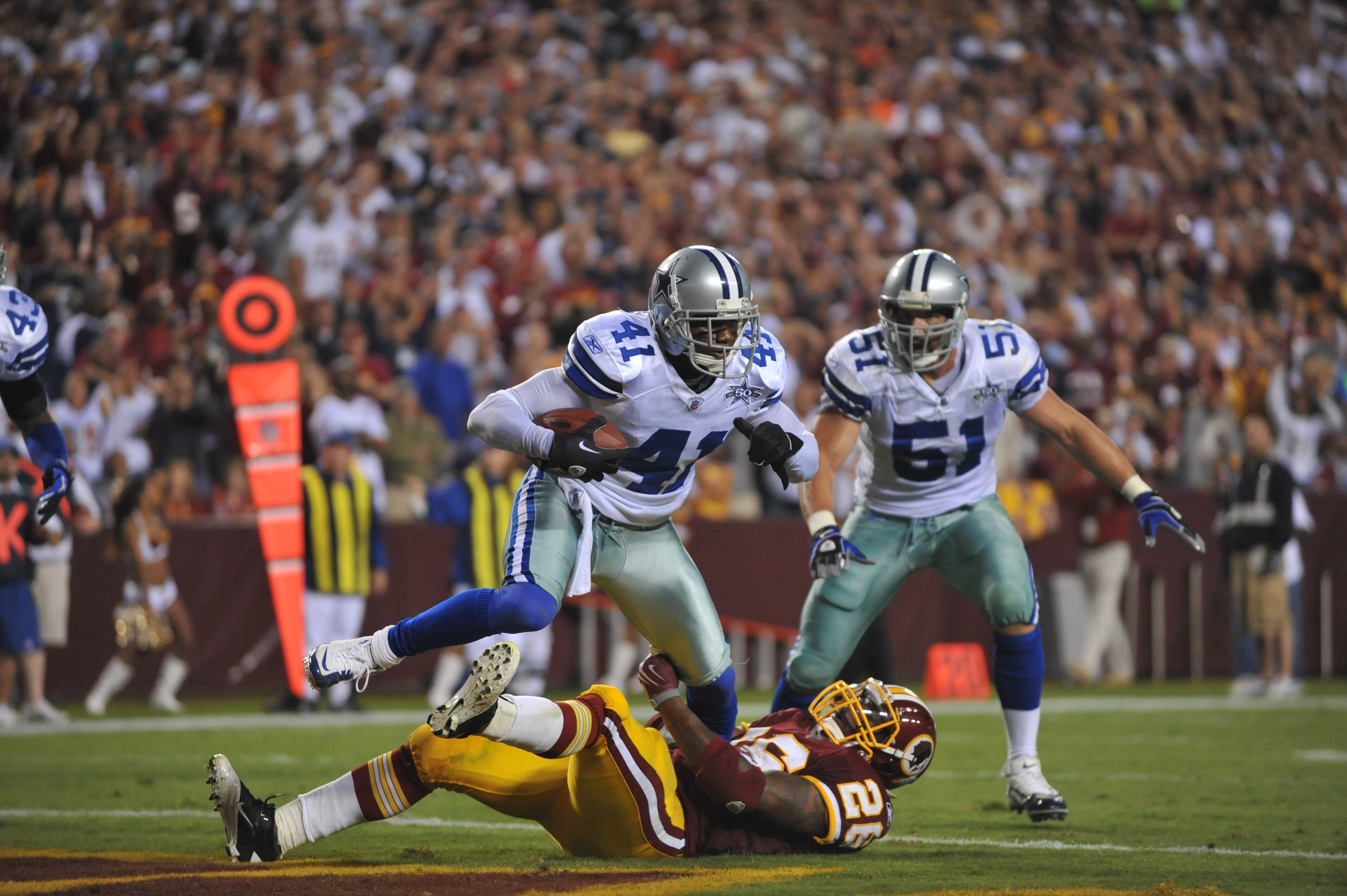 LANDOVER - SEPTEMBER 12:  Terence Newman #41 of the Dallas Cowboys makes an apparent interception on a play called back during the NFL season opener against the Washington Redskins at FedExField on September 12, 2010 in Landover, Maryland. The Redskins de