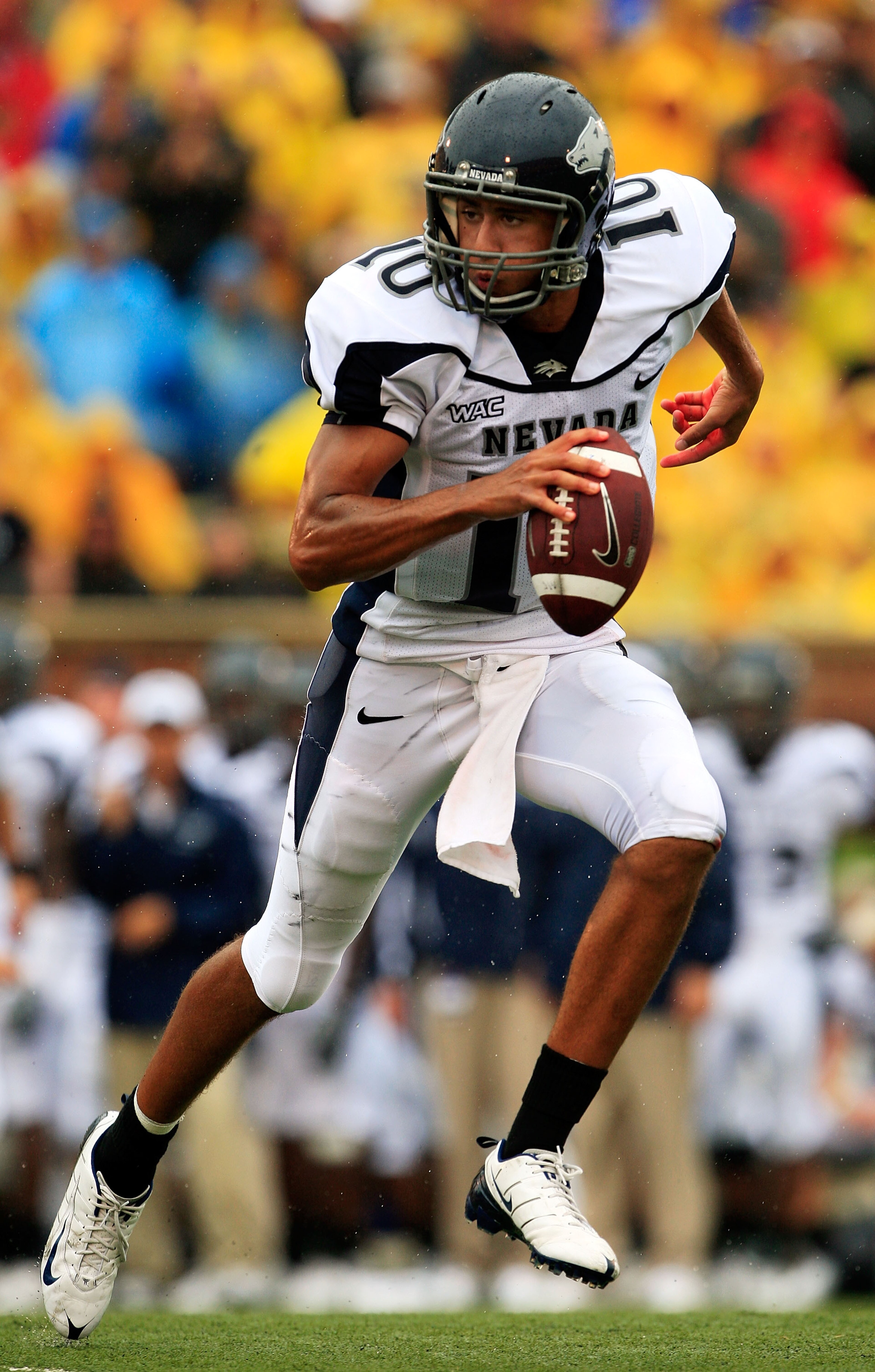 COLUMBIA, MO - SEPTEMBER 13:  Quarterback Colin Kaepernick #10 of the Nevada Wolf Pack rolls out during the first half of the game against the Missouri Tigers on September 13, 2008 at Memorial Stadium in Columbia, Missouri.  (Photo by Jamie Squire/Getty I