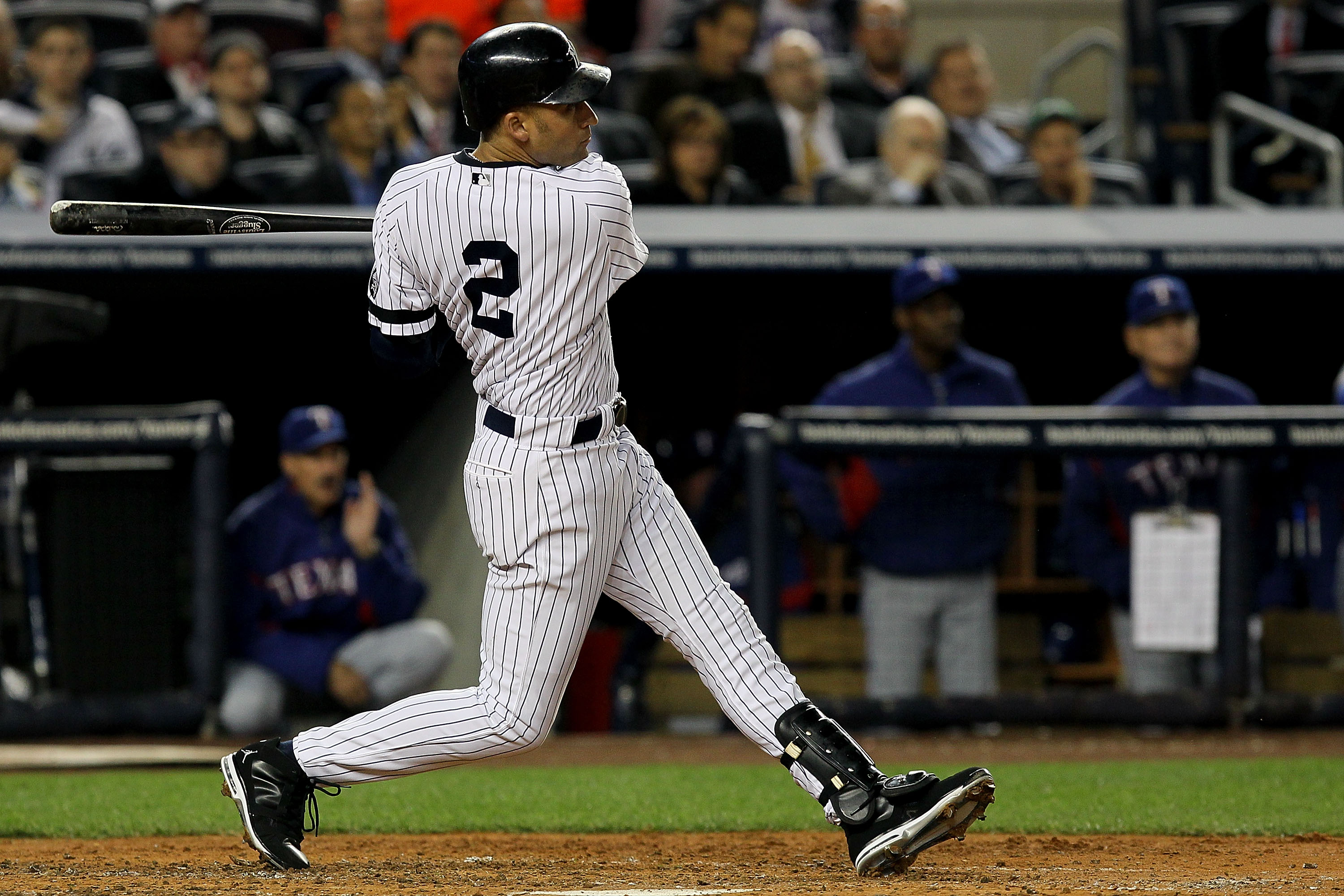 NEW YORK - OCTOBER 19:  Derek Jeter #2 of the New York Yankees hits a triple in the third inning against the Texas Rangers in Game Four of the ALCS during the 2010 MLB Playoffs at Yankee Stadium on October 19, 2010 in the Bronx borough of New York City.