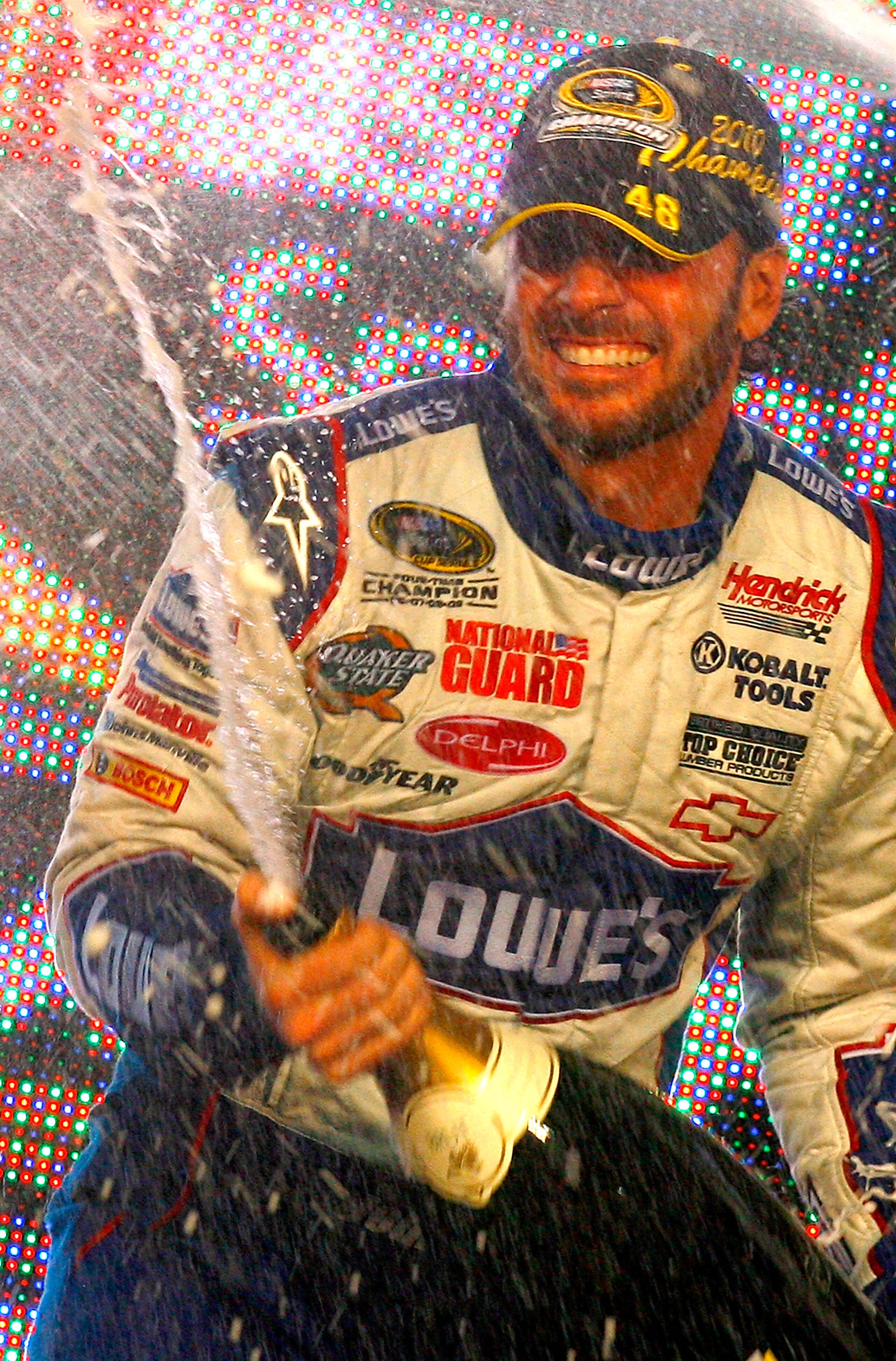 HOMESTEAD, FL - NOVEMBER 21: Jimmie Johnson, driver of the #48 Lowe's Chevrolet, sprays champagne after winning his fifth consecutive NASCAR Sprint Cup championship following the Ford 400 at Homestead-Miami Speedway on November 21, 2010 in Homestead, Flo HOMESTEAD, FL - NOVEMBER 21: Jimmie Johnson, driver of the #48 Lowe's Chevrolet, sprays champagne after winning his fifth consecutive NASCAR Sprint Cup championship following the Ford 400 at Homestead-Miami Speedway on November 21, 2010 in Homestead, Flo