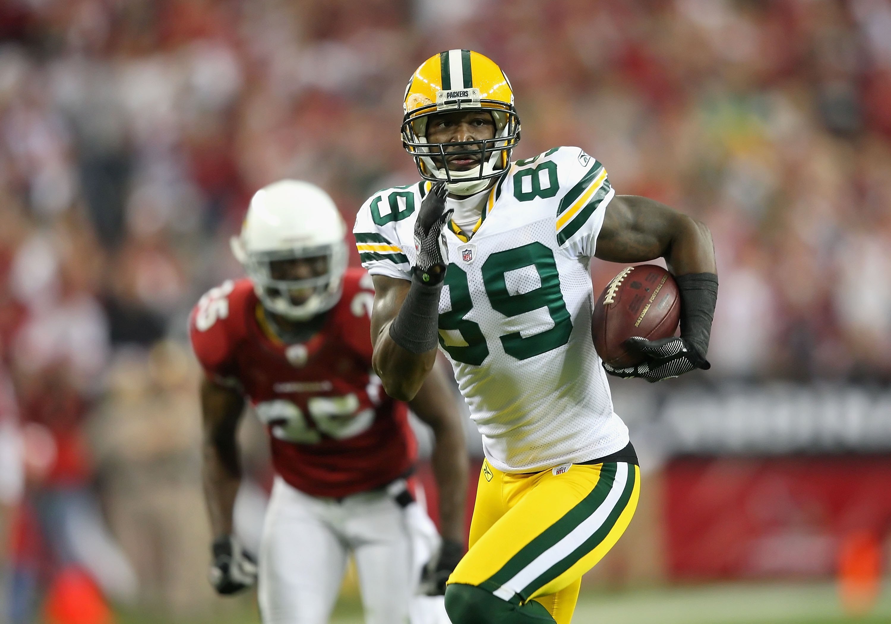 GLENDALE, AZ - JANUARY 10:  Wide receiver James Jones #89 of the Green Bay Packers runs with the football during the 2010 NFC wild-card playoff game against the Arizona Cardinals at the Universtity of Phoenix Stadium on January 10, 2010 in Glendale, Arizo