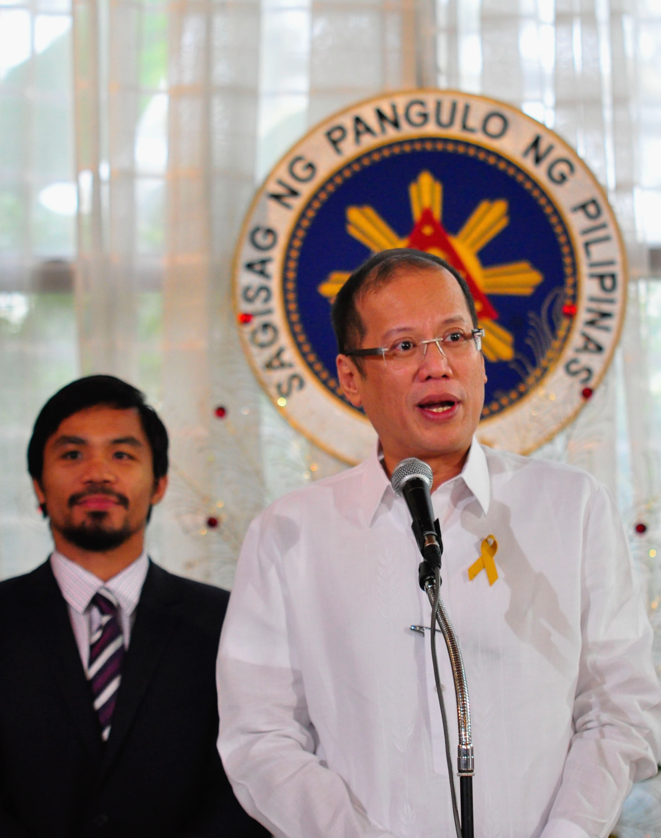 MANILA, PHILIPPINES - NOVEMBER 20:  Philippine President Benigno Aquinoo III addresses the audience at Malacanang Palace in Manila following Manny Pacquiao's win in the WBC super welterweight crown against Mexican Antonio Margarito on November 20, 2010 in