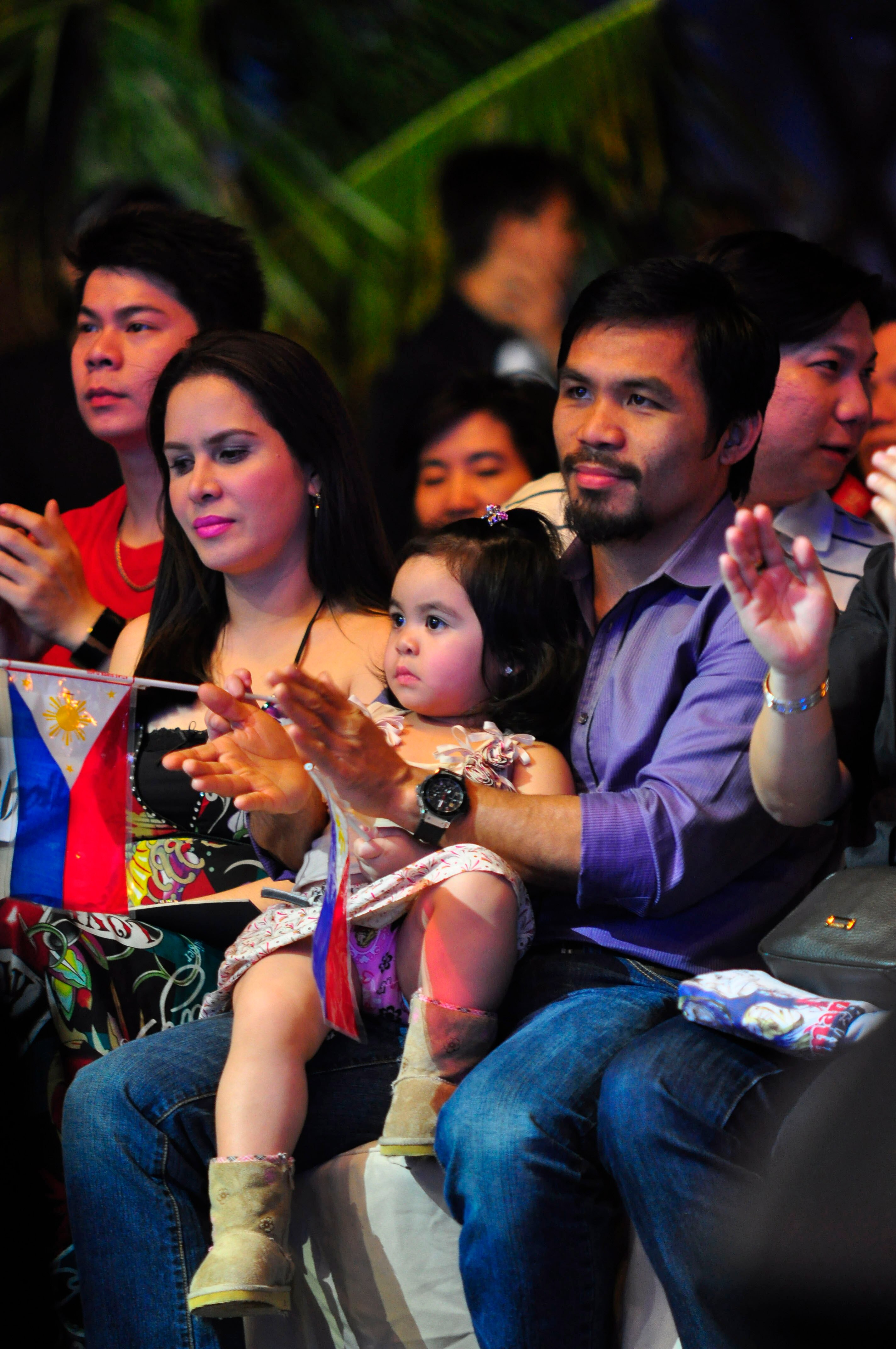 MANILA, PHILIPPINES - NOVEMBER 20:  Boxer and congressman, Manny Pacquiao attends his concert in Manila with wife Jinky and youngest daughter Qeen Elizabeth following his win of the WBC super welterweight crown against Mexican Antonio Margarito on Novembe