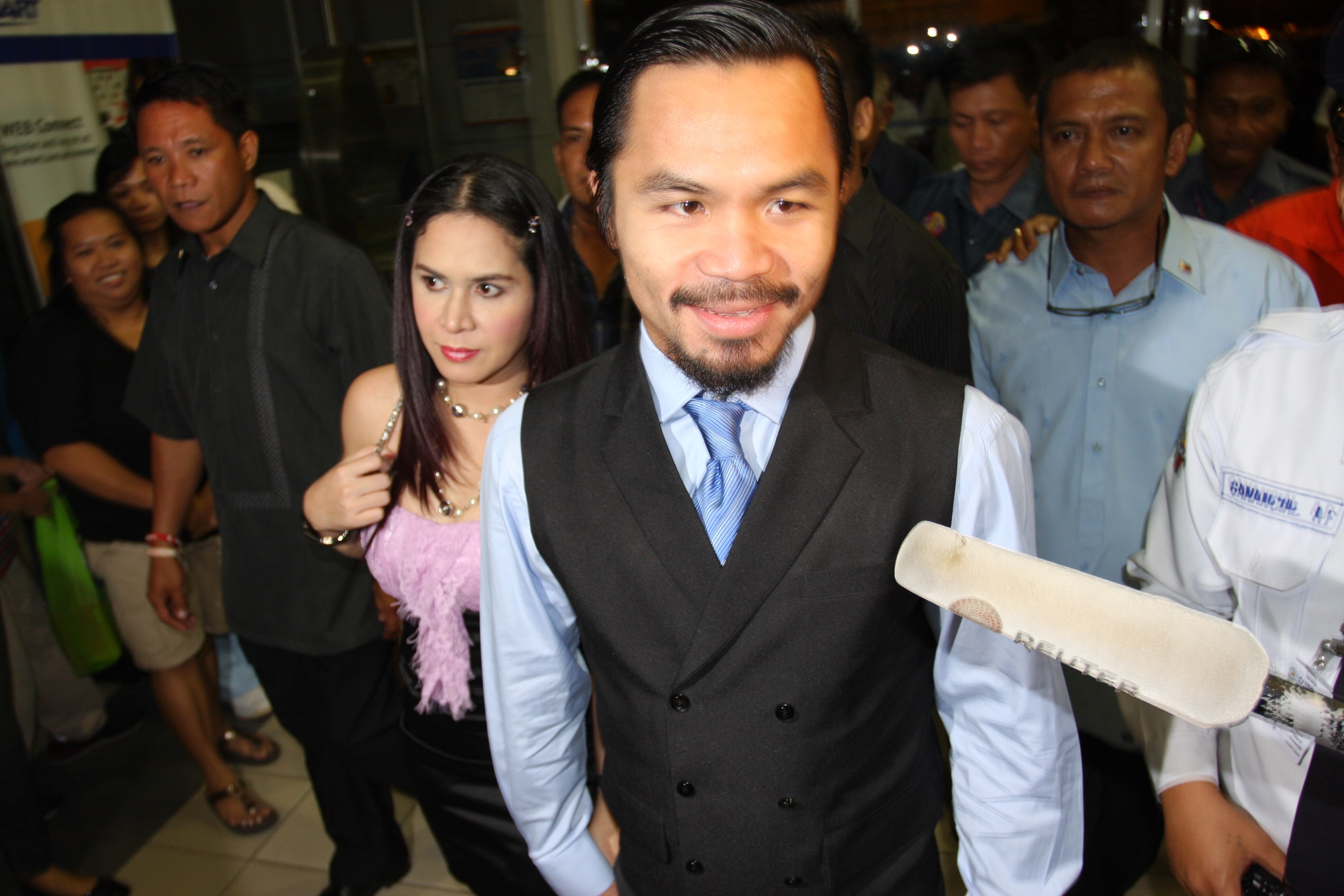 GENERAL SANTOS, PHILIPPINES - MAY 15:  World welterweight boxing champion Manny Pacquiao and wife Jinkee Pacquiao arrive at the KCC Mall on May 15, 2010 in General Santos, Philippines. Pacquiao was there to celebrate his election on becoming a member of H