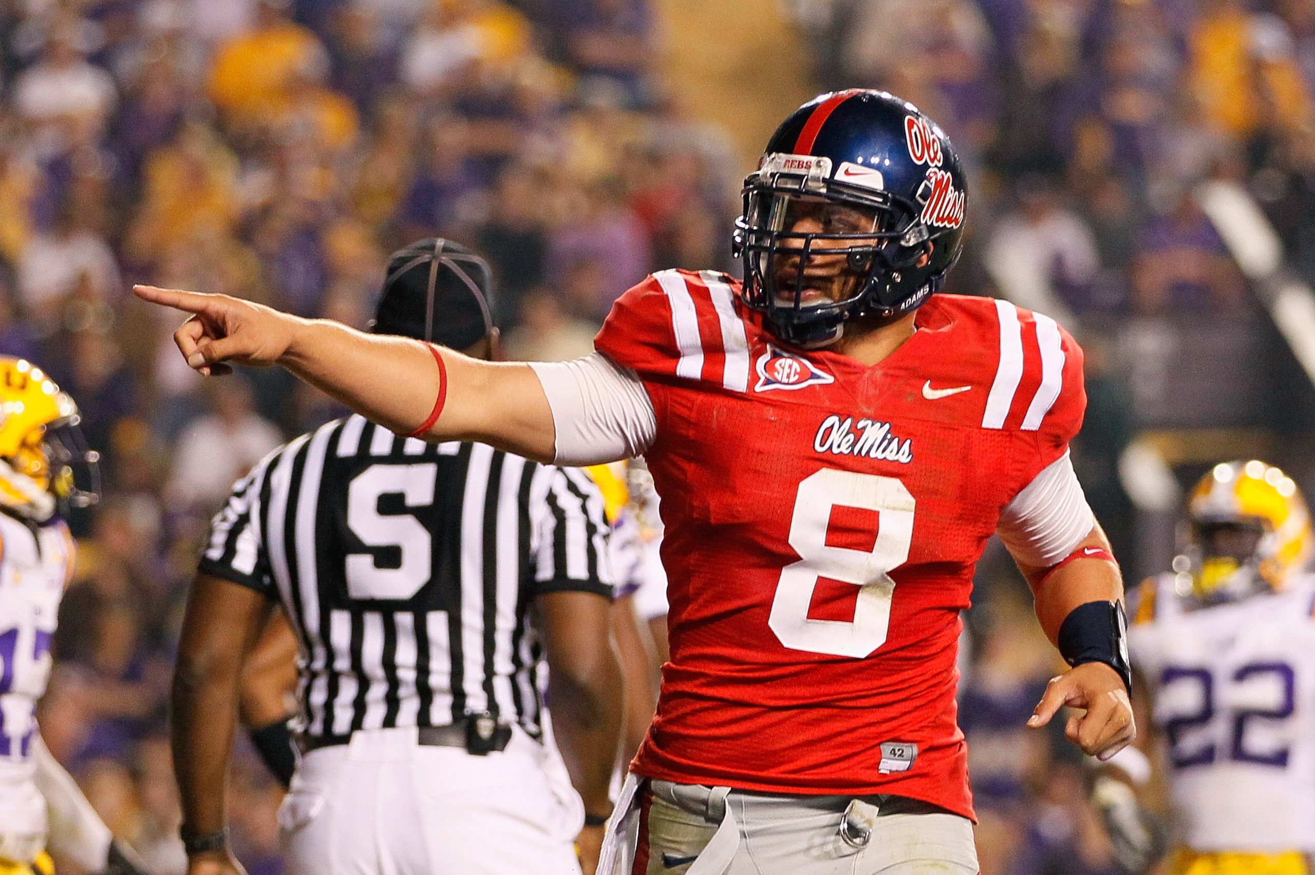BATON ROUGE, LA - NOVEMBER 20:  Quarterback Jeremiah Masoli #8 of the Ole Miss Rebels reacts after scoring his second touchdown against the Louisiana State University Tigers at Tiger Stadium on November 20, 2010 in Baton Rouge, Louisiana.  (Photo by Kevin