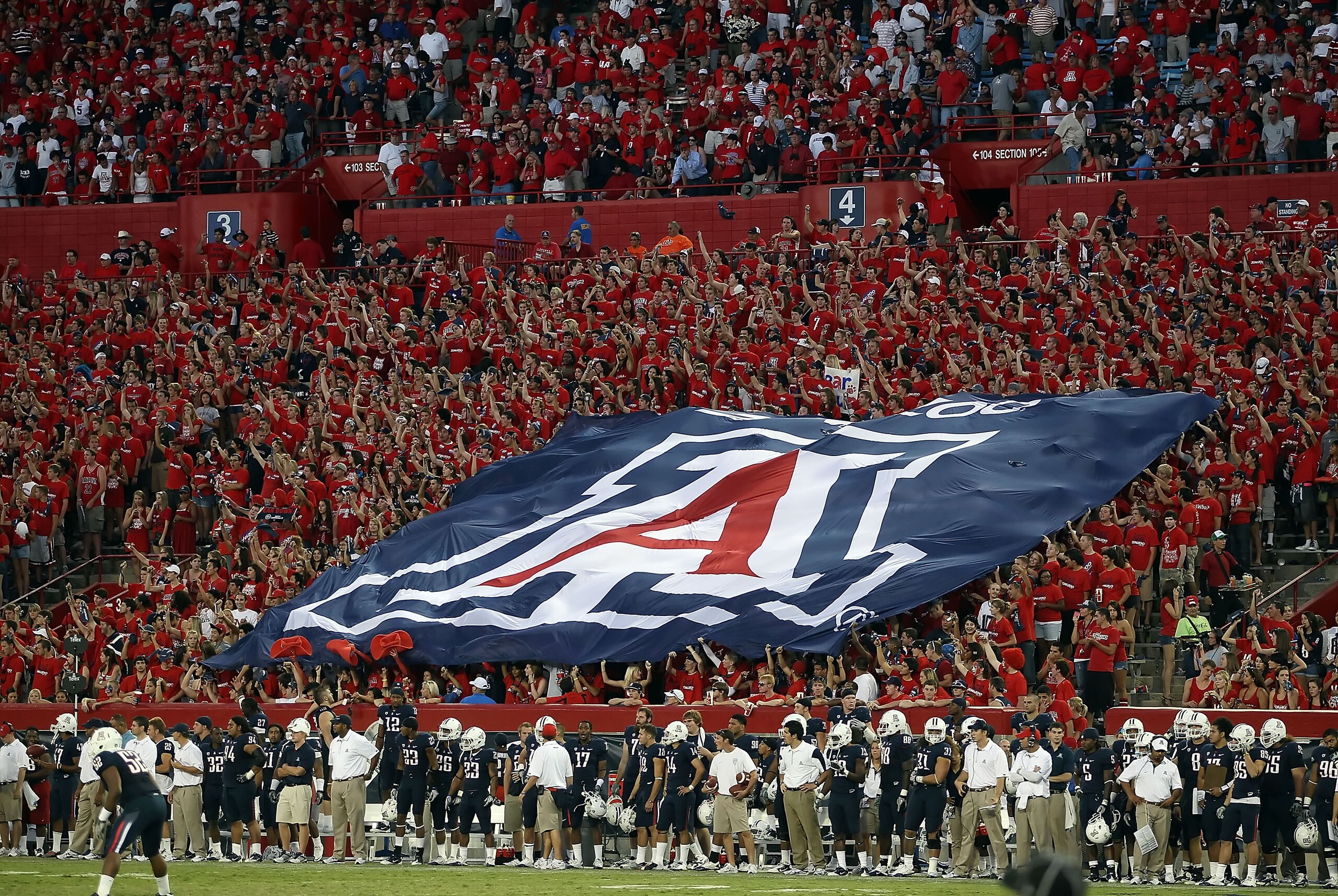 TUCSON, AZ - OCTOBER 09: A flag for the Arizona Wildcats is held by fans during the college football game against the Oregon State Beavers at Arizona Stadium on October 9, 2010 in Tucson, Arizona. The Beavers defeated the Wildcats 29-27. (Photo by Chris TUCSON, AZ - OCTOBER 09: A flag for the Arizona Wildcats is held by fans during the college football game against the Oregon State Beavers at Arizona Stadium on October 9, 2010 in Tucson, Arizona. The Beavers defeated the Wildcats 29-27. (Photo by Chris