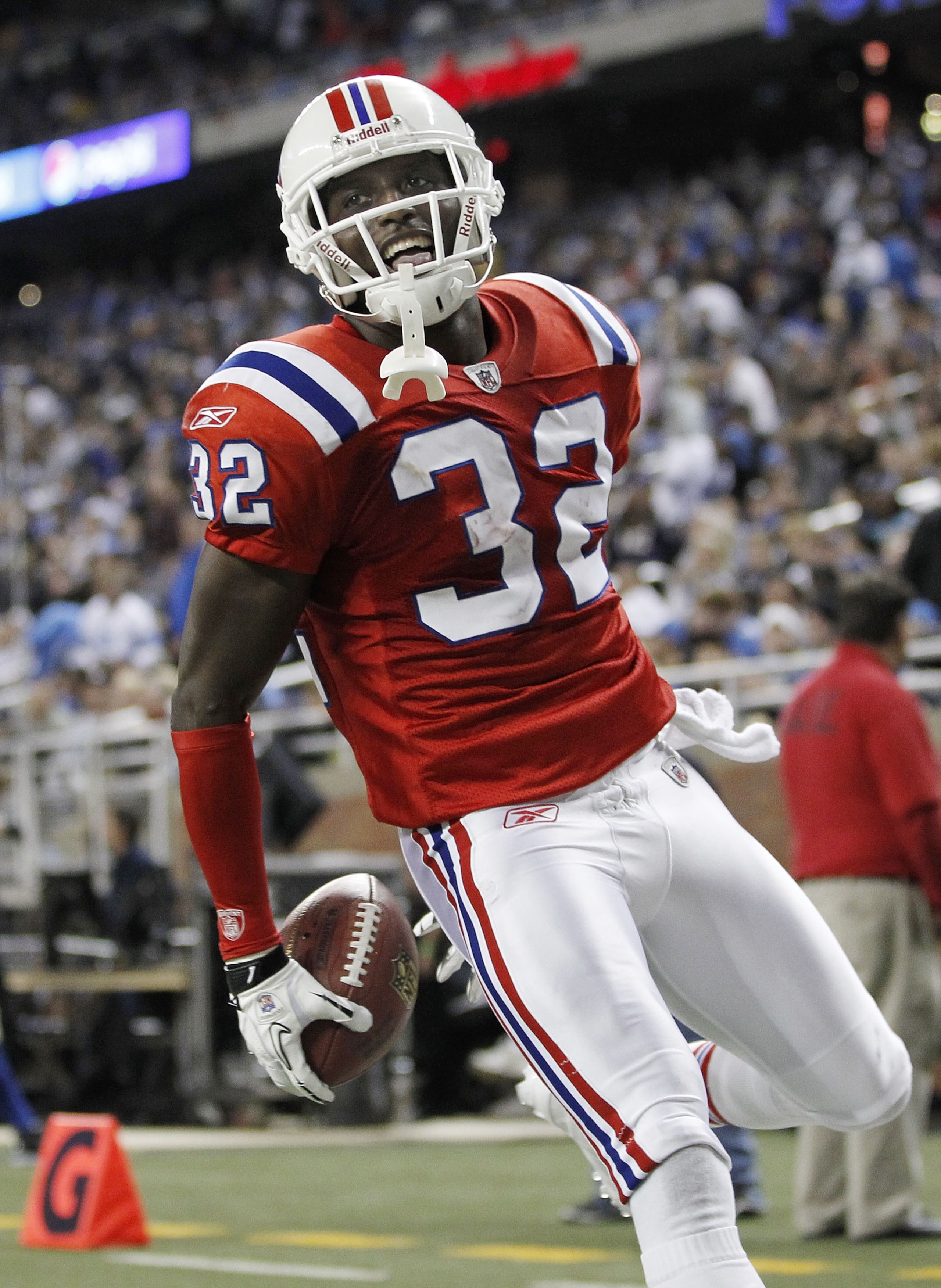 DETROIT - NOVEMBER 25:  Devin McCourty #32 of the New England Patriots celebrates a fourth quarter interception while playing the Detroit Lions on November 25, 2010 at Ford Field in Detroit, Michigan. New England won the game 45-24.  (Photo by Gregory Sha