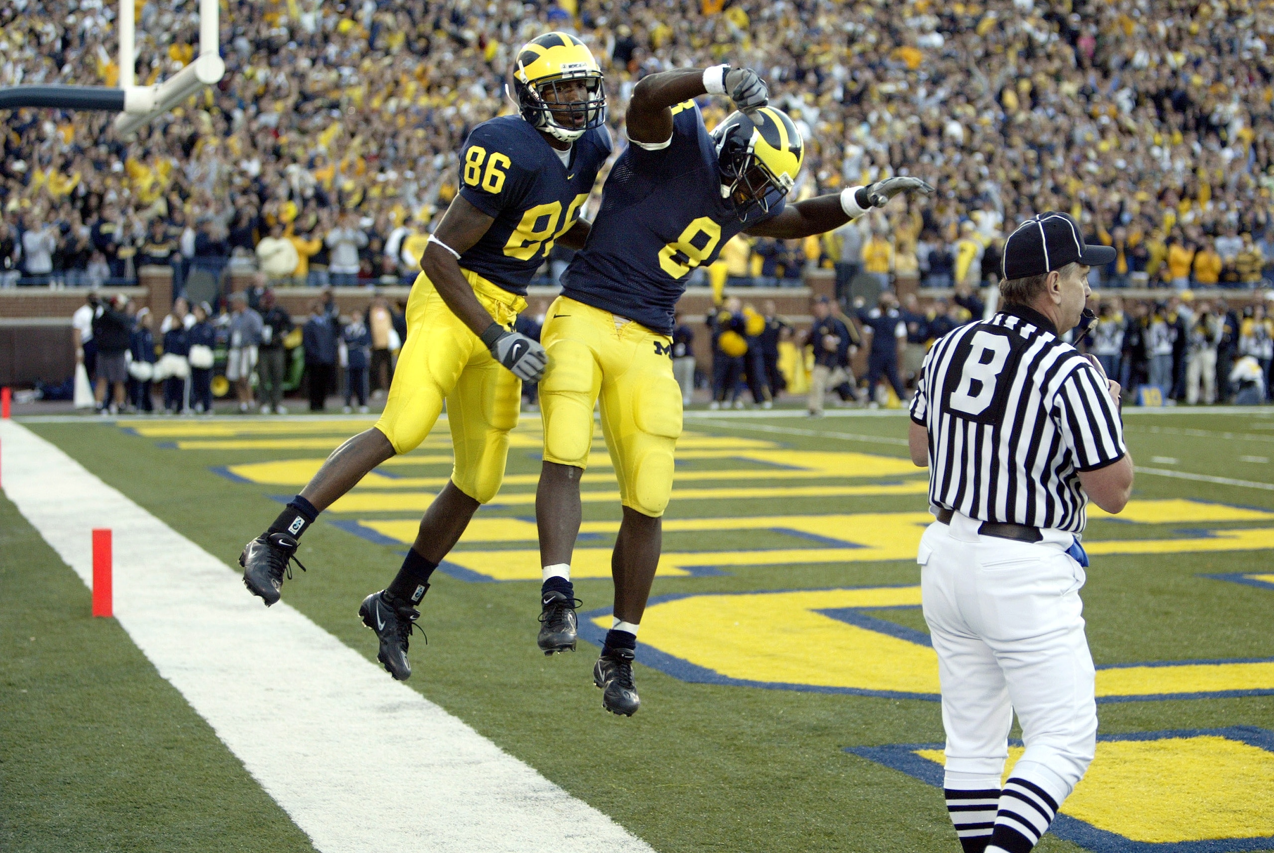 ANN ARBOR, MI - OCTOBER 15:  Mario Manningham #86 and Jason Avant #8 of the Michigan Wolverines celebrate after Manningham scored on a 33-yard touchdown pass in the fourth quarter against the Penn State Nittany Lions on October 15, 2005 at Michigan Stadiu
