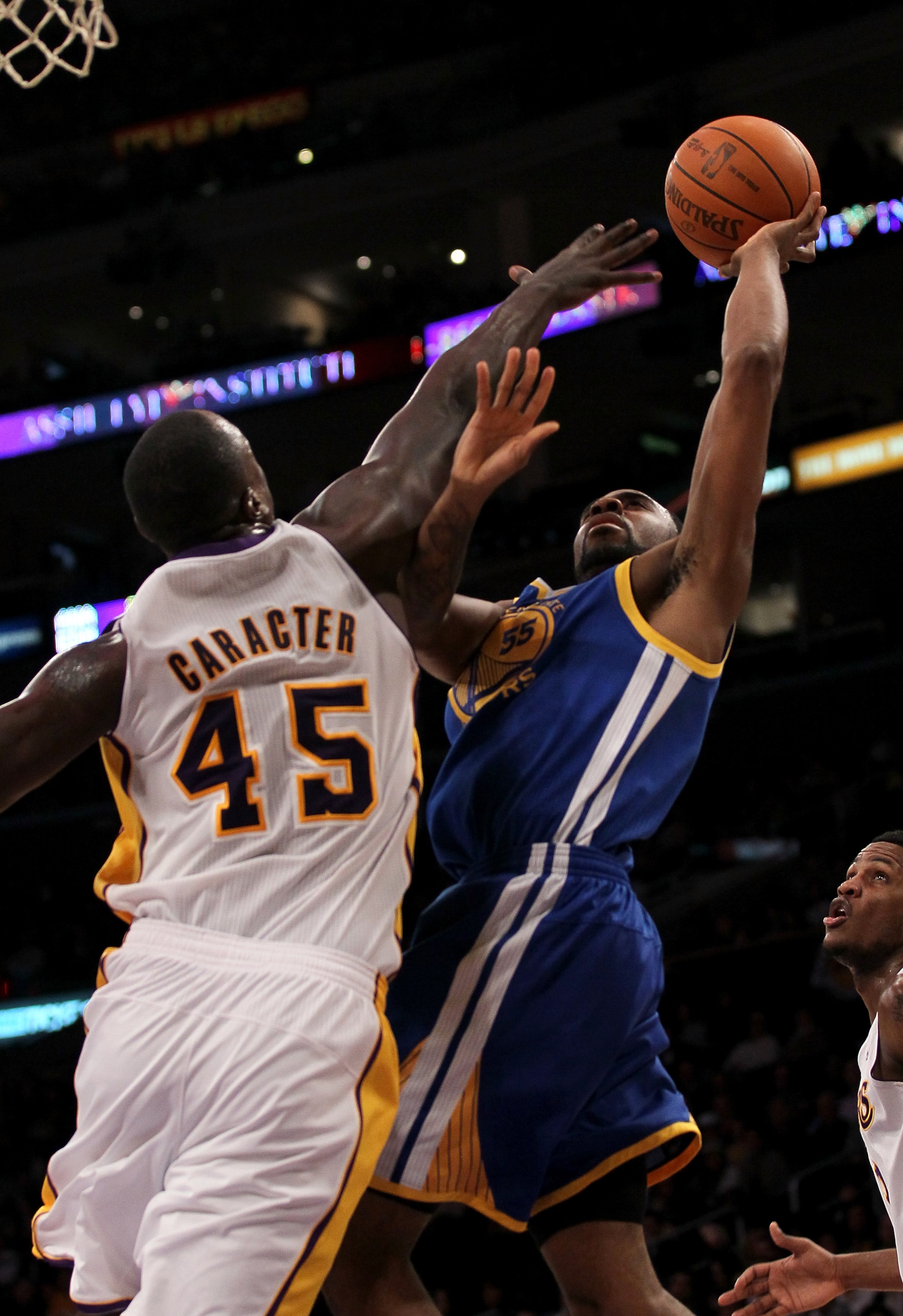 LOS ANGELES - NOVEMBER 21: Reggie Williams #55 of the Golden State Warriors shoots over Derrick Caracter #45 of the Los Angeles Lakers at Staples Center on November 21, 2010 in Los Angeles, California.   The Lakers won 117-89. NOTE TO USER: User expressly
