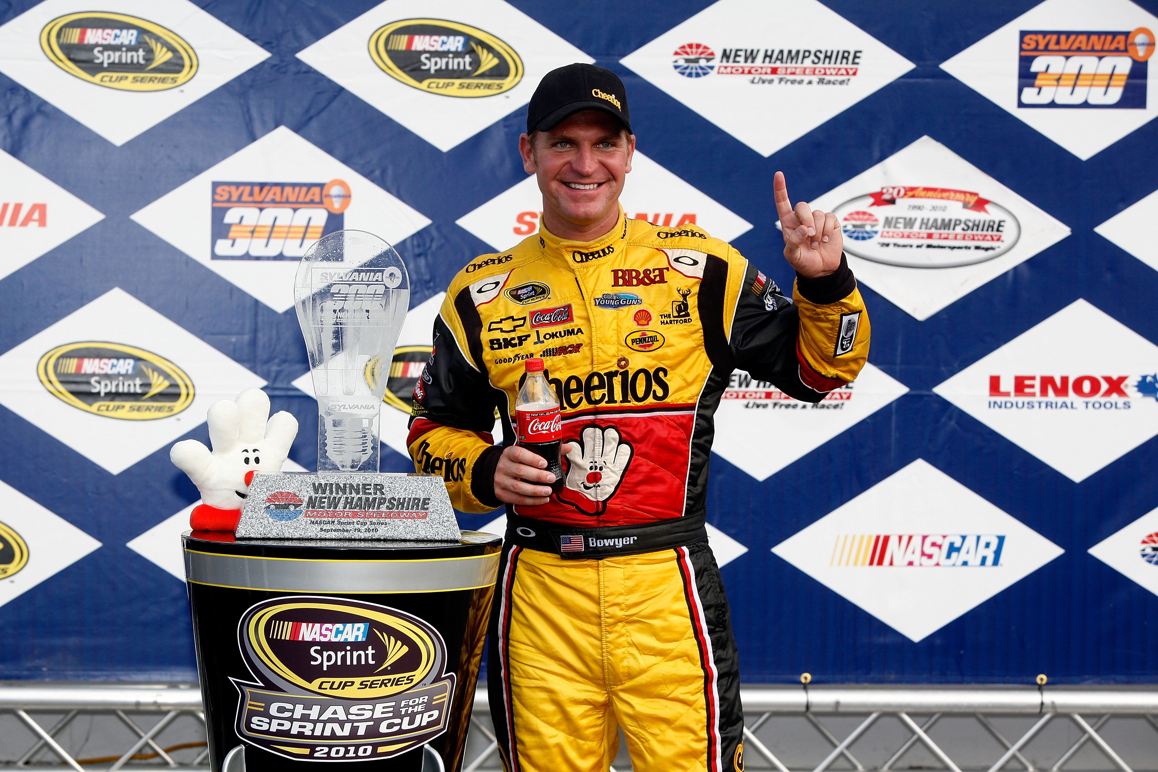 LOUDON, NH - SEPTEMBER 19:  Clint Bowyer, driver of the #33 Cheerios / Hamburger Helper Chevrolet celebrates with the trophy in victory lane after winning the NASCAR Sprint Cup Series Sylvania 300 at New Hampshire Motor Speedway on September 19, 2010 in L