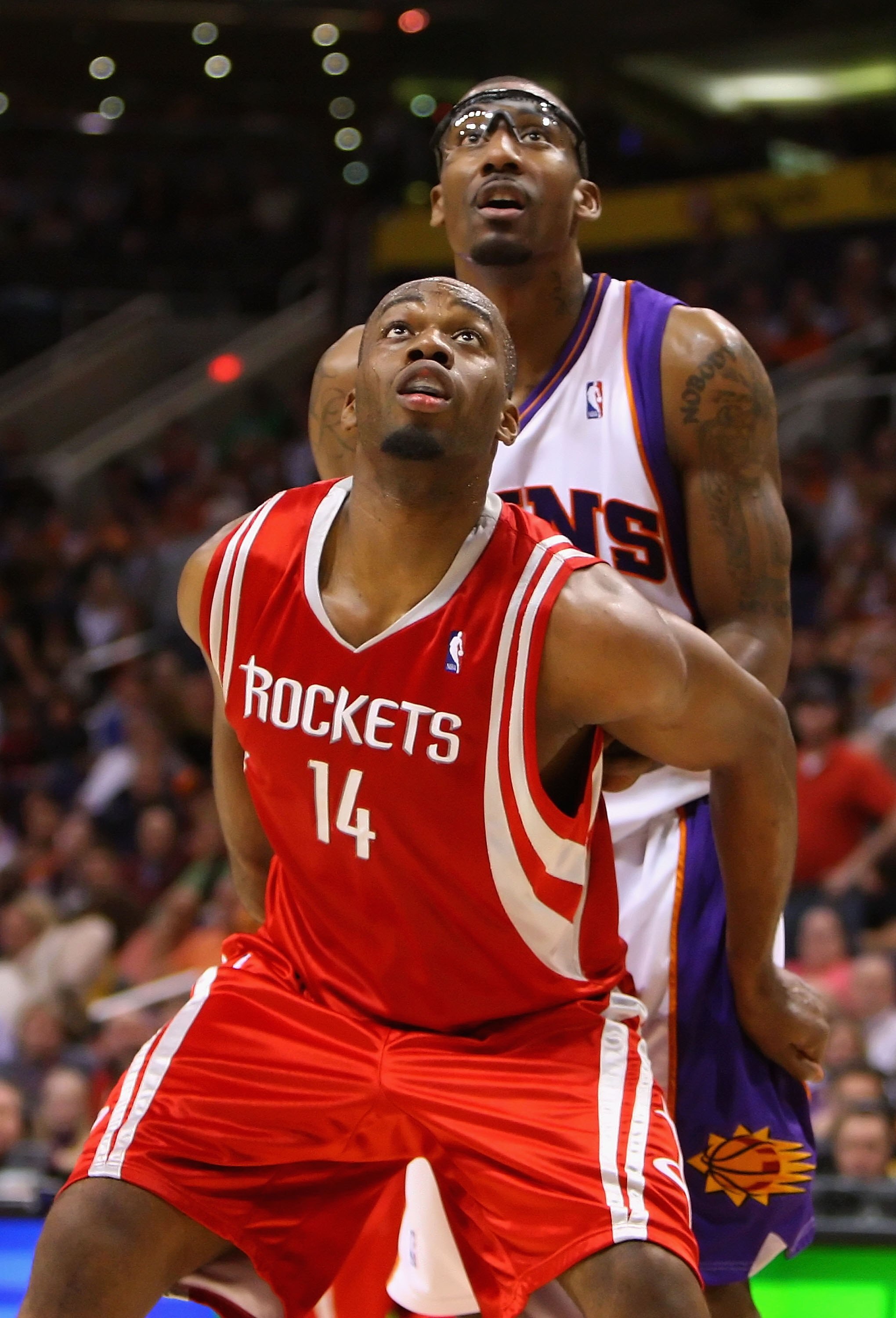PHOENIX - JANUARY 06:  Carl Landry #14 of the Houston Rockets blocks out Amar'e Stoudemire #1 of the Phoenix Suns during the NBA game at US Airways Center on January 6, 2010 in Phoenix, Arizona. The Suns defeated the Rockets 118-110.  NOTE TO USER: User e