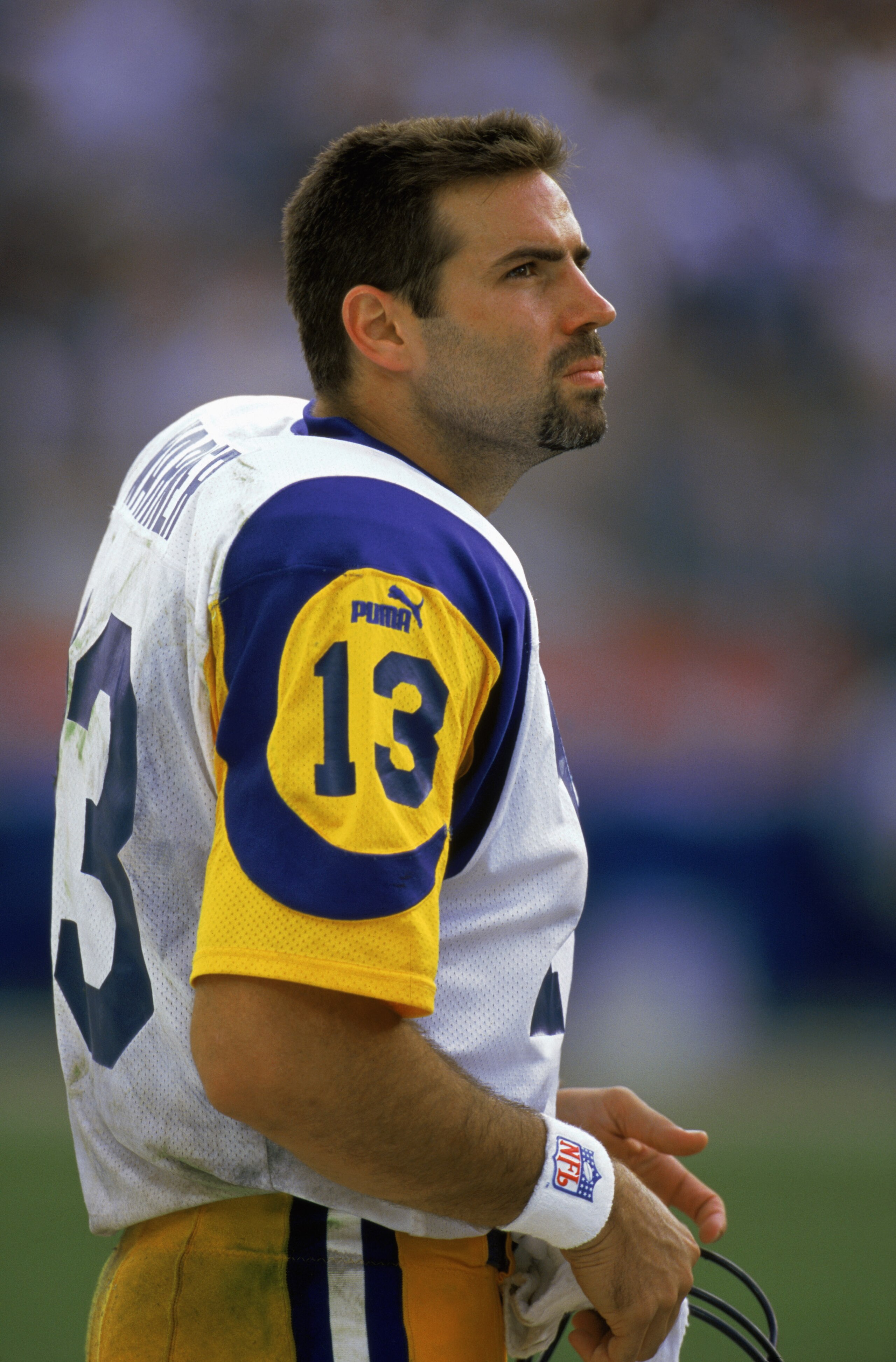 NASHVILLE, TN - OCTOBER 31:  Quarterback Kurt Warner #13 of the St. Louis Rams stands on the sidelines during the NFL game against the Tennessee Titans at Adelphia Coliseum in Nashville, Tennessee on October 31, 1999.  The Titans defeated the Rams 24-21.