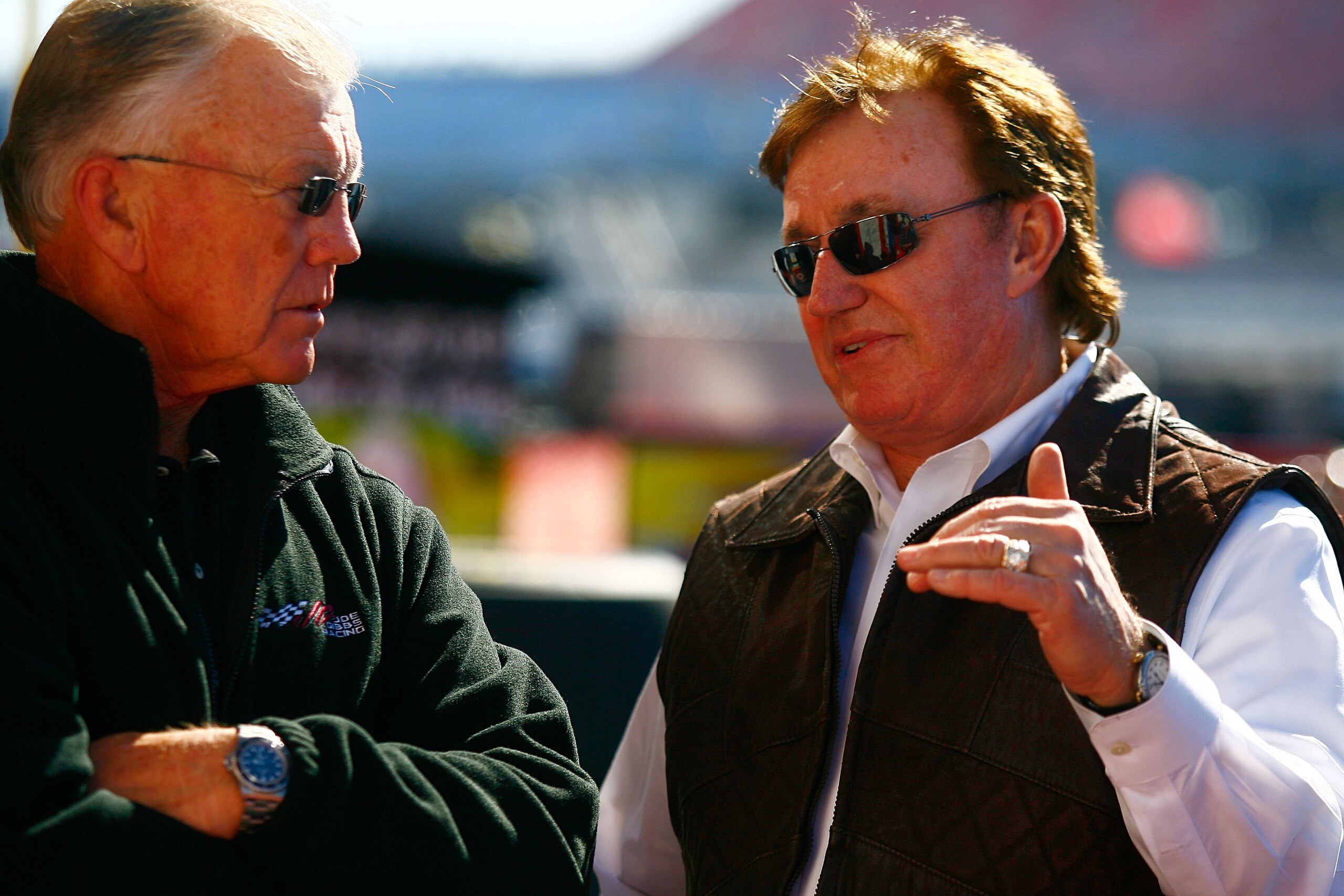 TALLADEGA, AL - OCTOBER 29:  Team owners Joe Gibbs (L) and Richard Childress talk in the garage area during practice for the NASCAR Sprint Cup Series AMP Energy Juice 500 at Talladega Superspeedway on October 29, 2010 in Talladega, Alabama.  (Photo by Jas