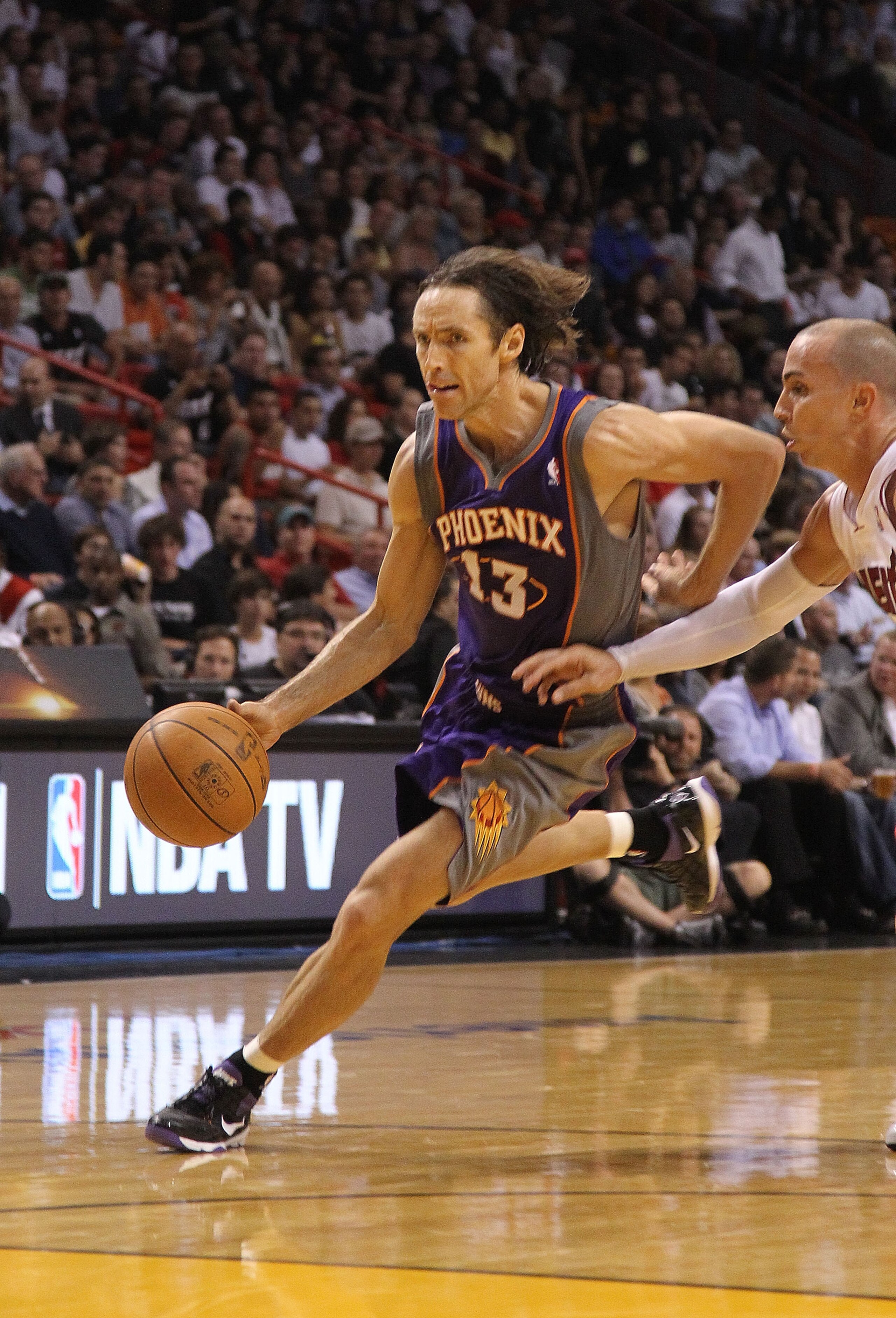 MIAMI - NOVEMBER 17:  Steve Nash #13  of the Phoenix Suns drives to the rim during a game against the  Miami Heat at American Airlines Arena on November 17, 2010 in Miami, Florida. NOTE TO USER: User expressly acknowledges and agrees that, by downloading