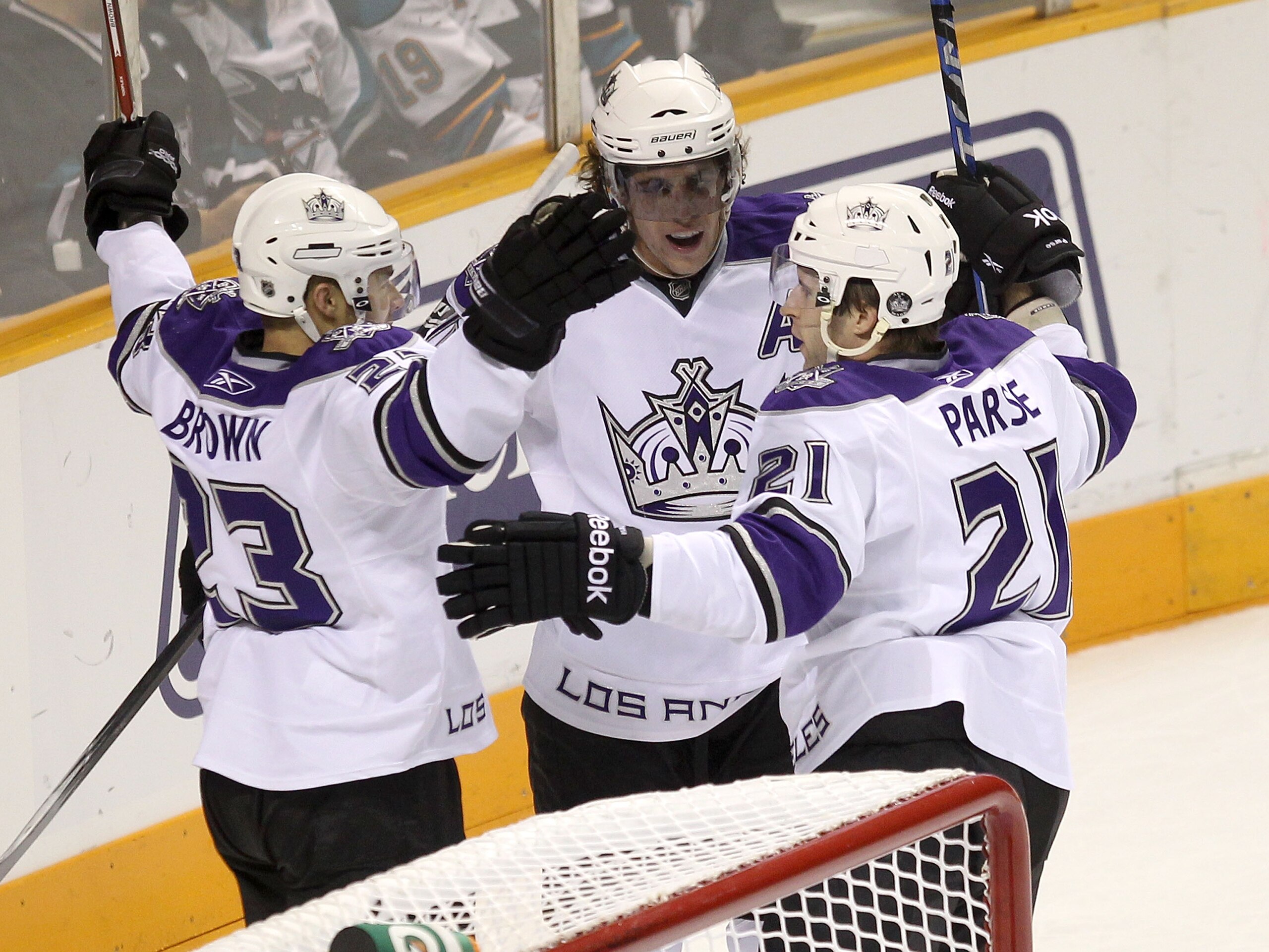 SAN JOSE, CA - NOVEMBER 15:  Dustin Brown #23, Anze Kopitar #11 and Scott Parse #21 of the Los Angeles Kings celebrate after Parse scored a goal against the San Jose Sharks at HP Pavilion on November 15, 2010 in San Jose, California.  (Photo by Ezra Shaw/