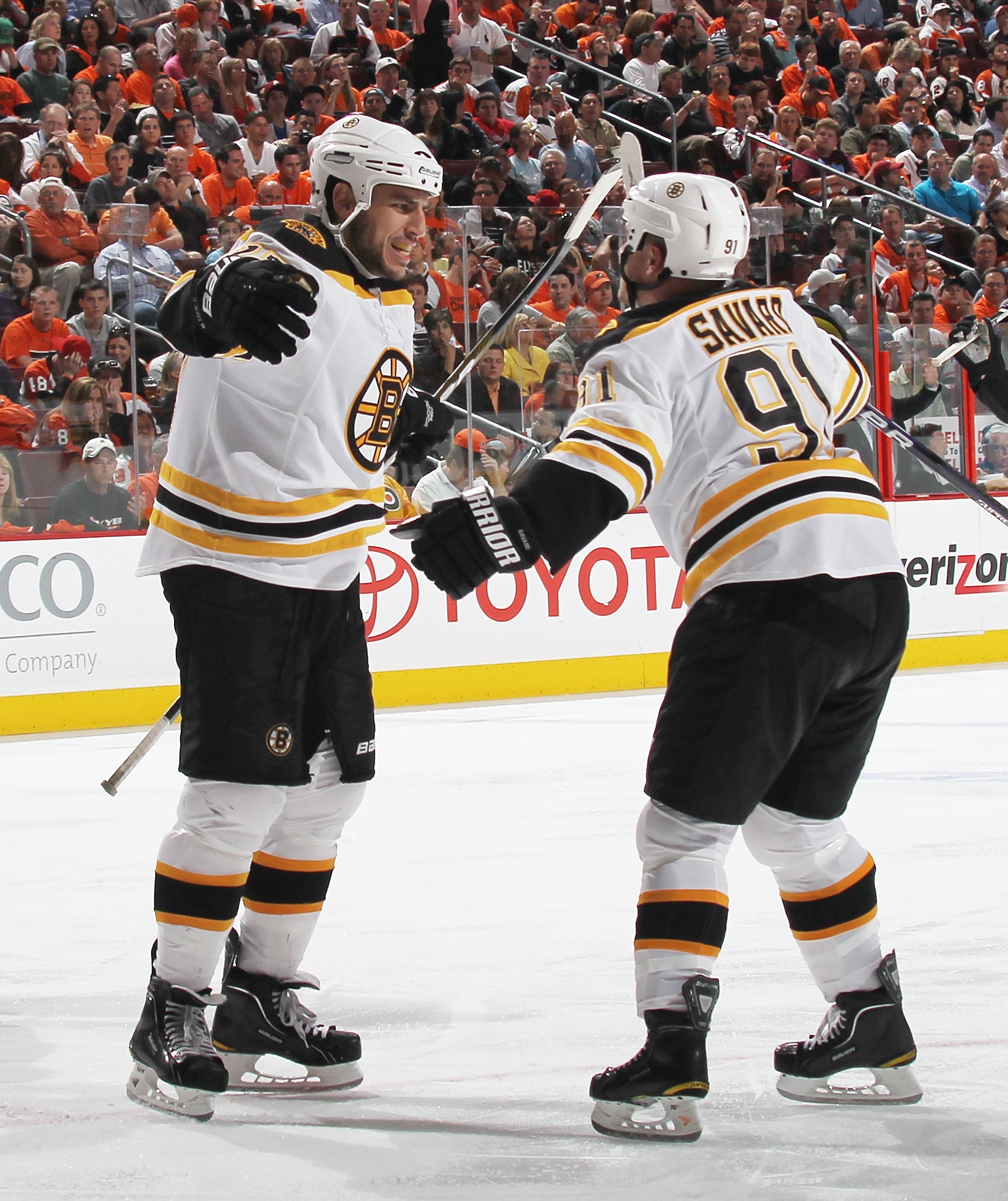 PHILADELPHIA - MAY 07: Milan Lucic #17 of the Boston Bruins celebrates a goal with Marc Savard #91 against the Philadelphia Flyers in Game Four of the Eastern Conference Semifinals during the 2010 NHL Stanley Cup Finals at the Wachovia Center on May 7, 20