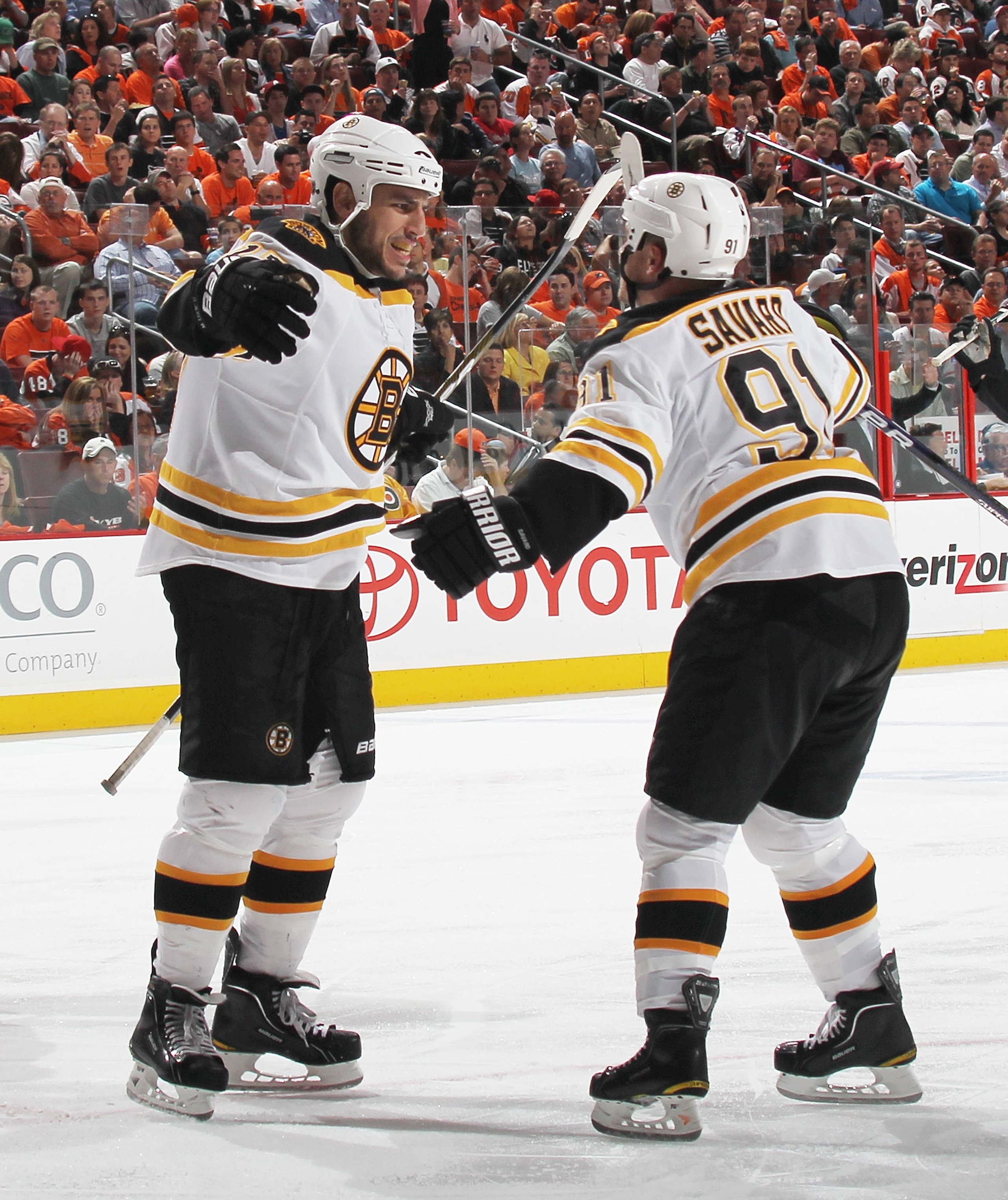 PHILADELPHIA - MAY 07: Milan Lucic #17 of the Boston Bruins celebrates a goal with Marc Savard #91 against the Philadelphia Flyers in Game Four of the Eastern Conference Semifinals during the 2010 NHL Stanley Cup Finals at the Wachovia Center on May 7, 20