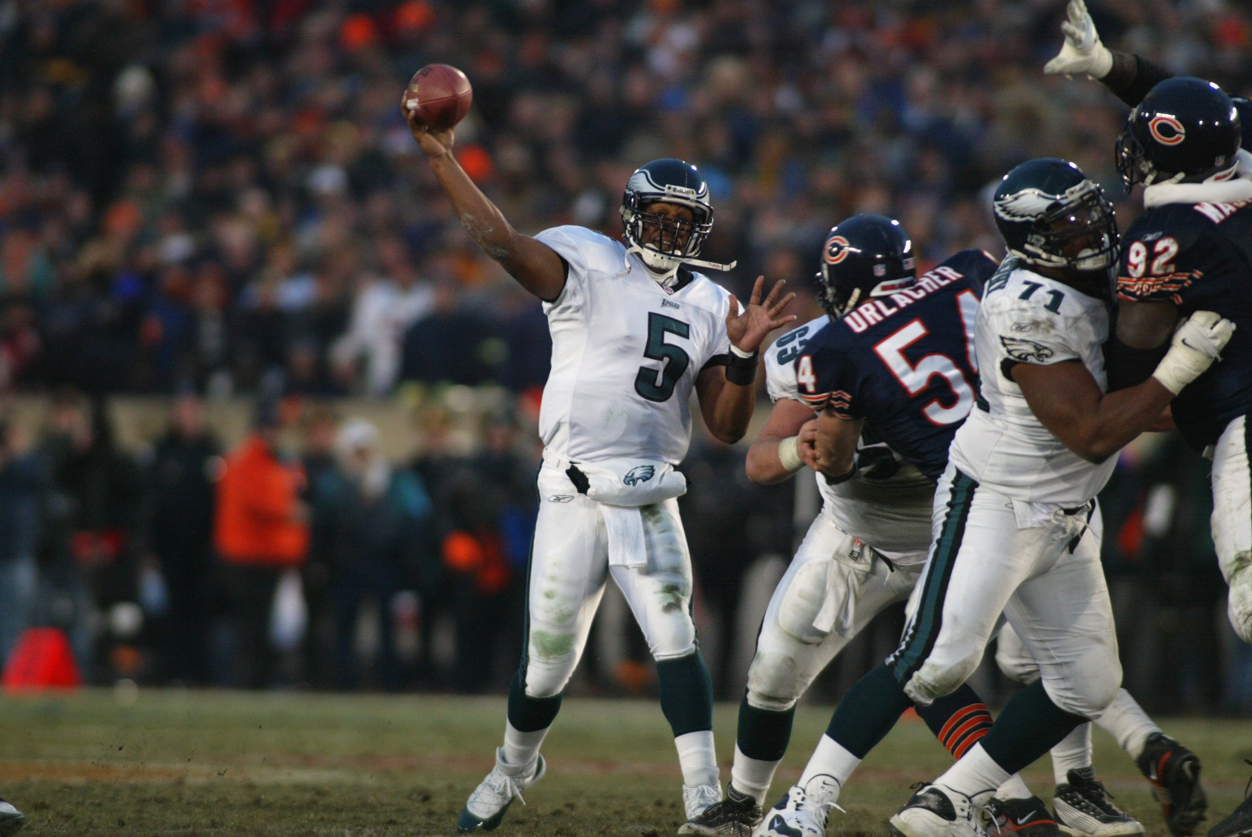 19 Jan 2002:  Quarterback Donovan McNabb #5  of the Philadelphia Eagles delivers a pass against the defense of Brian Urlacher #54 of the Chicago Bears during the NFC Divisional Playoff at Soldier Field in Chicago, Illinois. Eagles win 33-19 over the Bears
