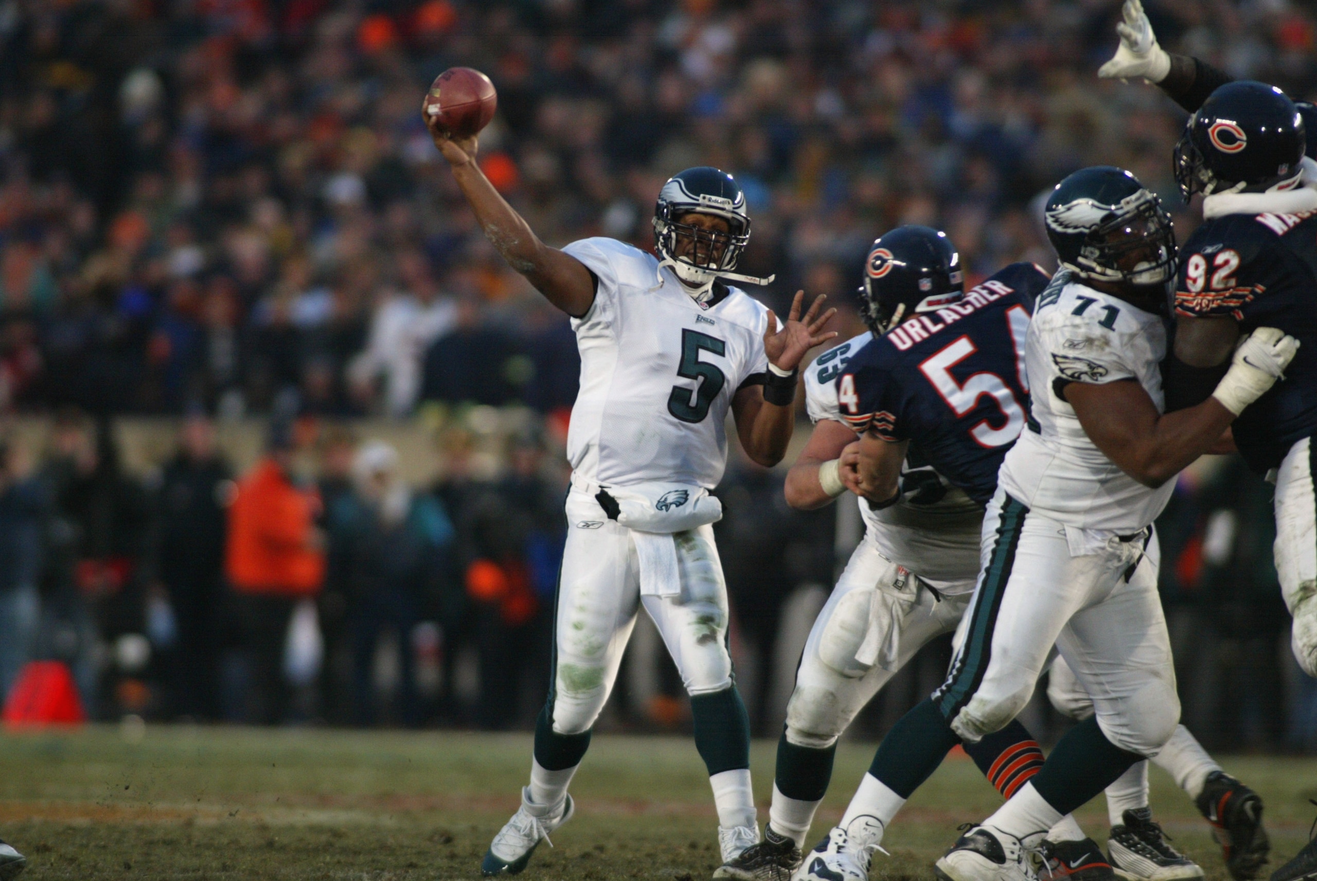 19 Jan 2002:  Quarterback Donovan McNabb #5  of the Philadelphia Eagles delivers a pass against the defense of Brian Urlacher #54 of the Chicago Bears during the NFC Divisional Playoff at Soldier Field in Chicago, Illinois. Eagles win 33-19 over the Bears