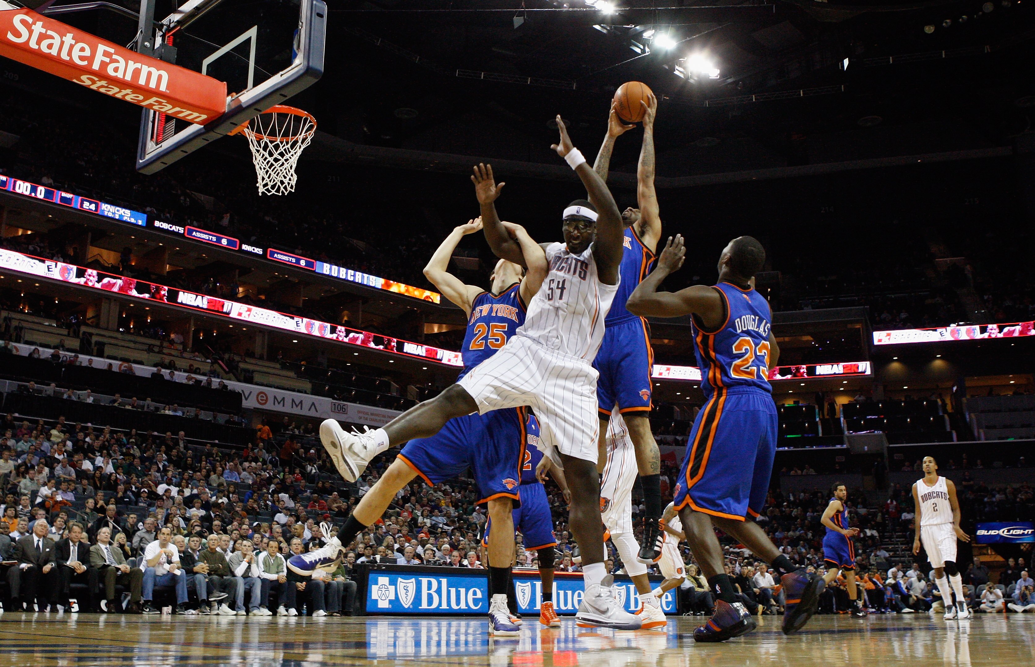 CHARLOTTE, NC - NOVEMBER 24:  Wilson Chandler #21 of the New York Knicks goes up for a loose ball with Kwame Brown #54 of the Charlotte Bobcats during their game at Time Warner Cable Arena on November 24, 2010 in Charlotte, North Carolina.  NOTE TO USER: 