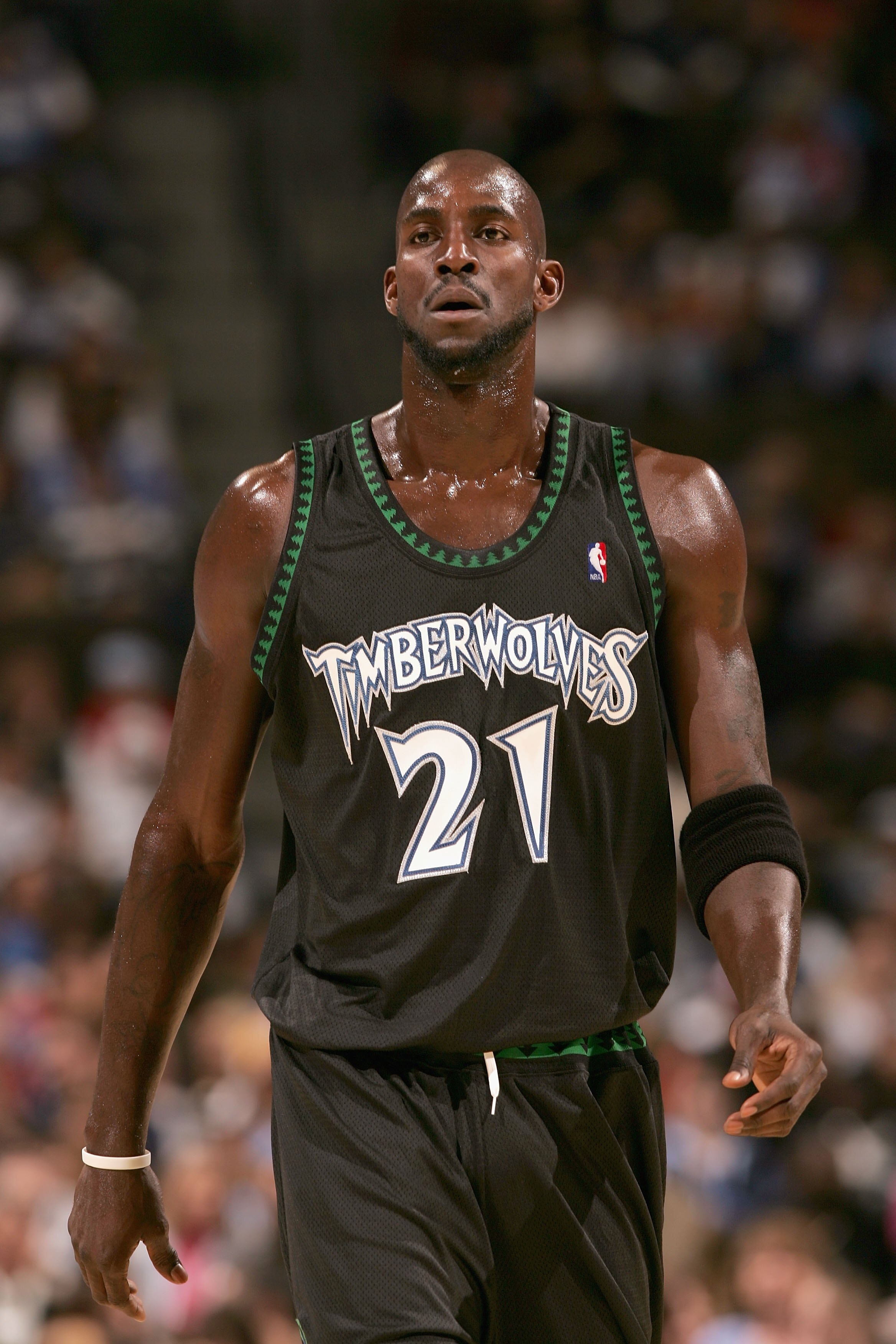 DENVER - NOVEMBER 3:  Kevin Garnett #21 of the Minnesota Timberwolves walks across the court during the game against the Denver Nuggets at Pepsi Center on November 3, 2006 in Denver, Colorado.  The Timberwolves won 112-109.   NOTE TO USER: User expressly