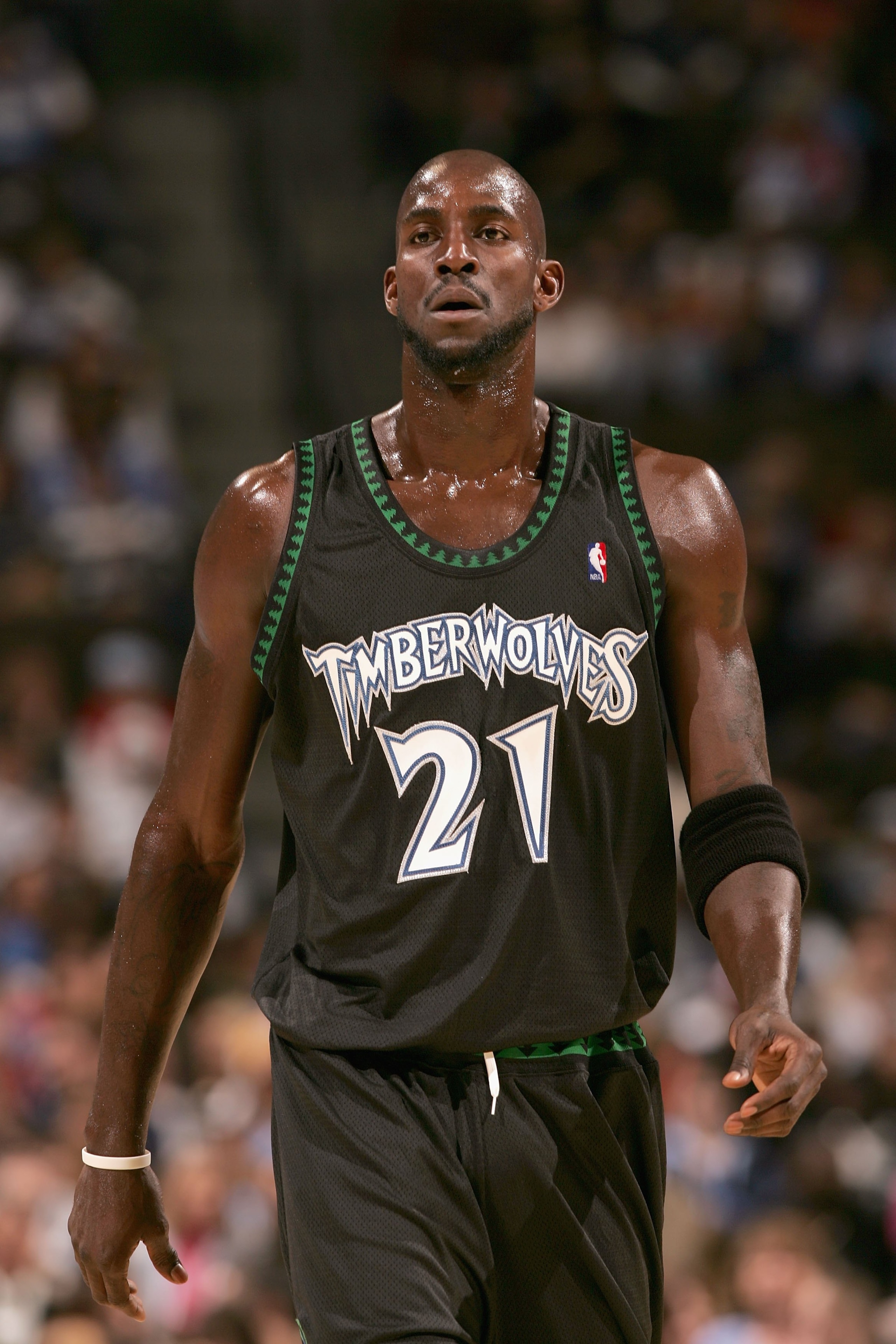 DENVER - NOVEMBER 3:  Kevin Garnett #21 of the Minnesota Timberwolves walks across the court during the game against the Denver Nuggets at Pepsi Center on November 3, 2006 in Denver, Colorado.  The Timberwolves won 112-109.   NOTE TO USER: User expressly