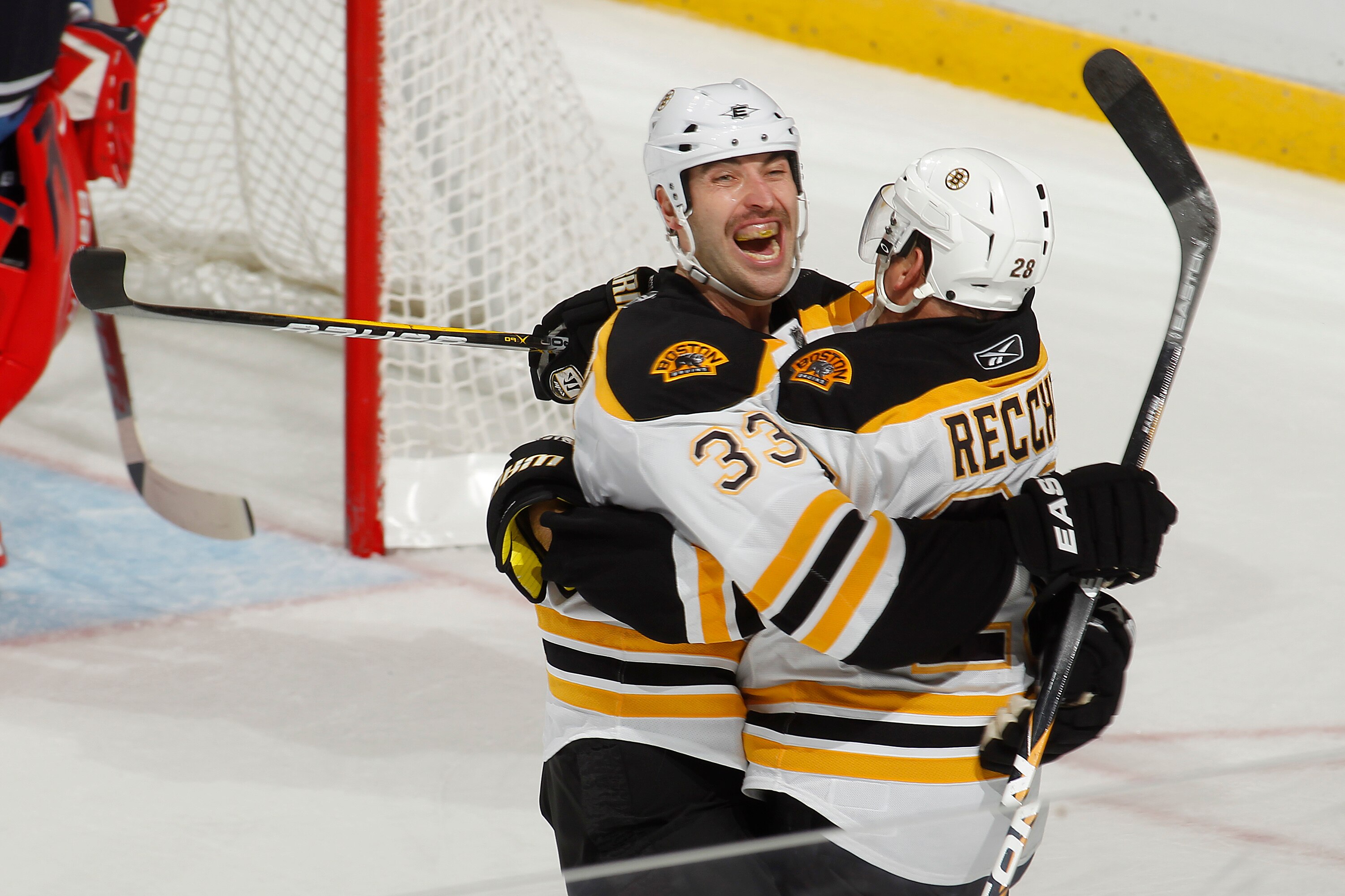 SUNRISE, FL - NOVEMBER 24: Mark Recchi #28 is congratulated by Zdeno Chara #33 of the Boston Bruins after he scored the third goal of the game against the Florida Panthers on November 24, 2010 at the BankAtlantic Center in Sunrise, Florida. (Photo by Joel