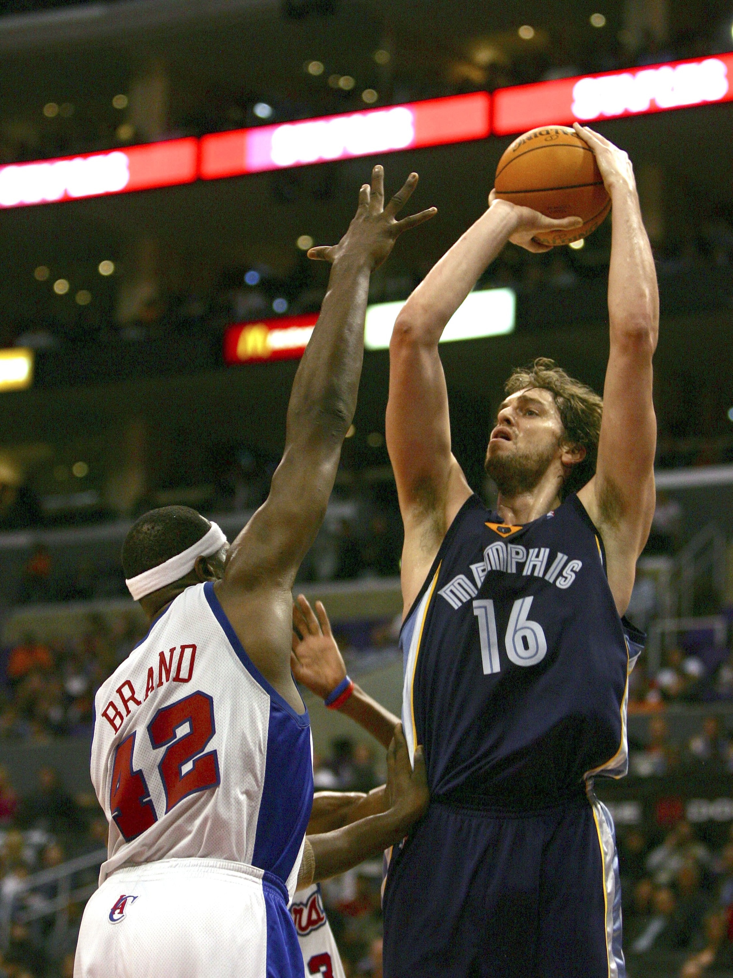 LOS ANGELES, CA - JANUARY 20:  Pau Gasol #16 of the Memphis Grizzlies shoot a jumper over the hands of Elton Brand #42 of the Los Angeles Clippers during the third quarter at the Staples Center on January 20, 2007 in Los Angeles, California. The Clippers
