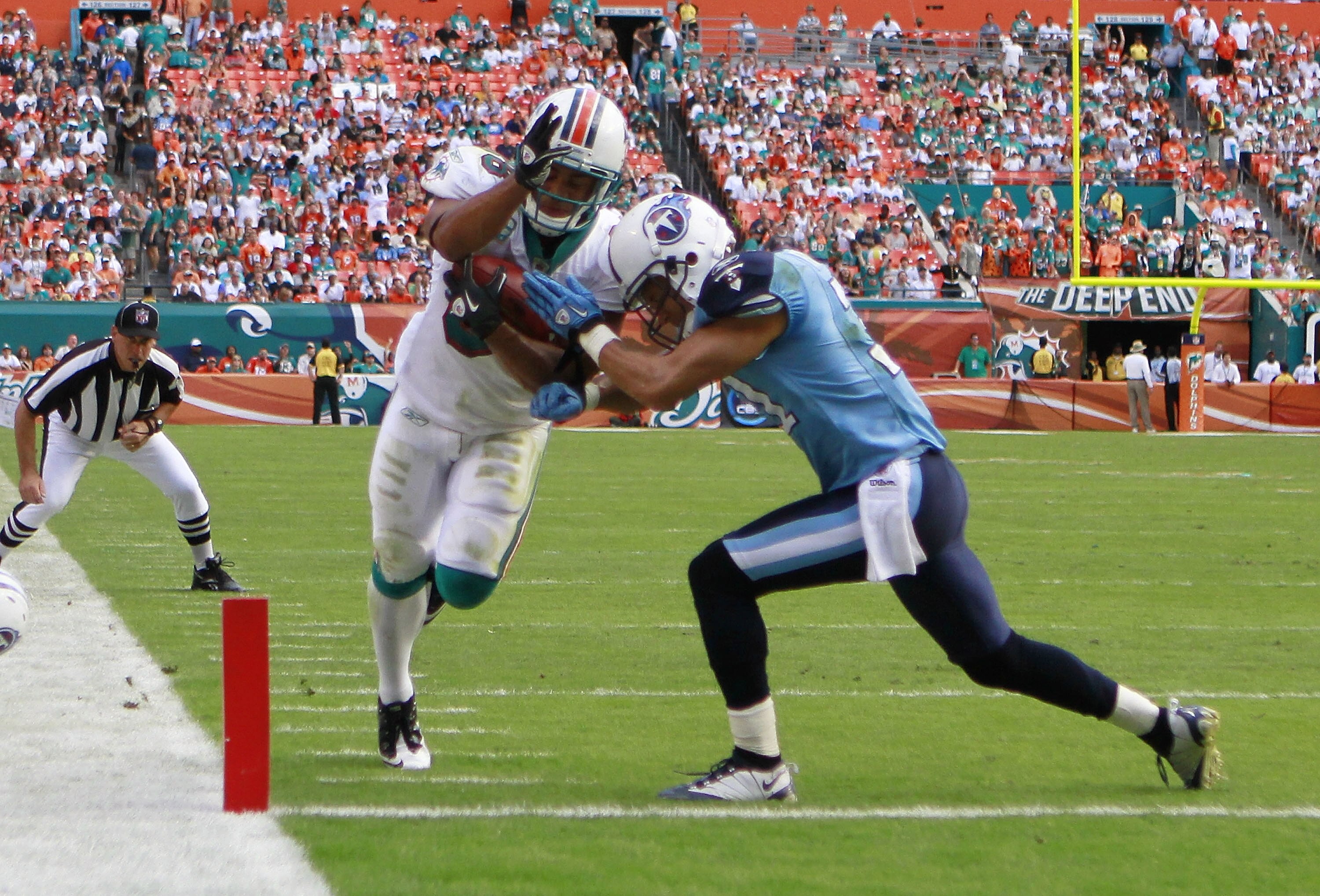 MIAMI - NOVEMBER 14:  Patrick Cobbs #38 of the Miami Dolphins scores a touchdown against the Tennessee Titans at Sun Life Stadium on November 14, 2010 in Miami, Florida.  (Photo by Marc Serota/Getty Images)