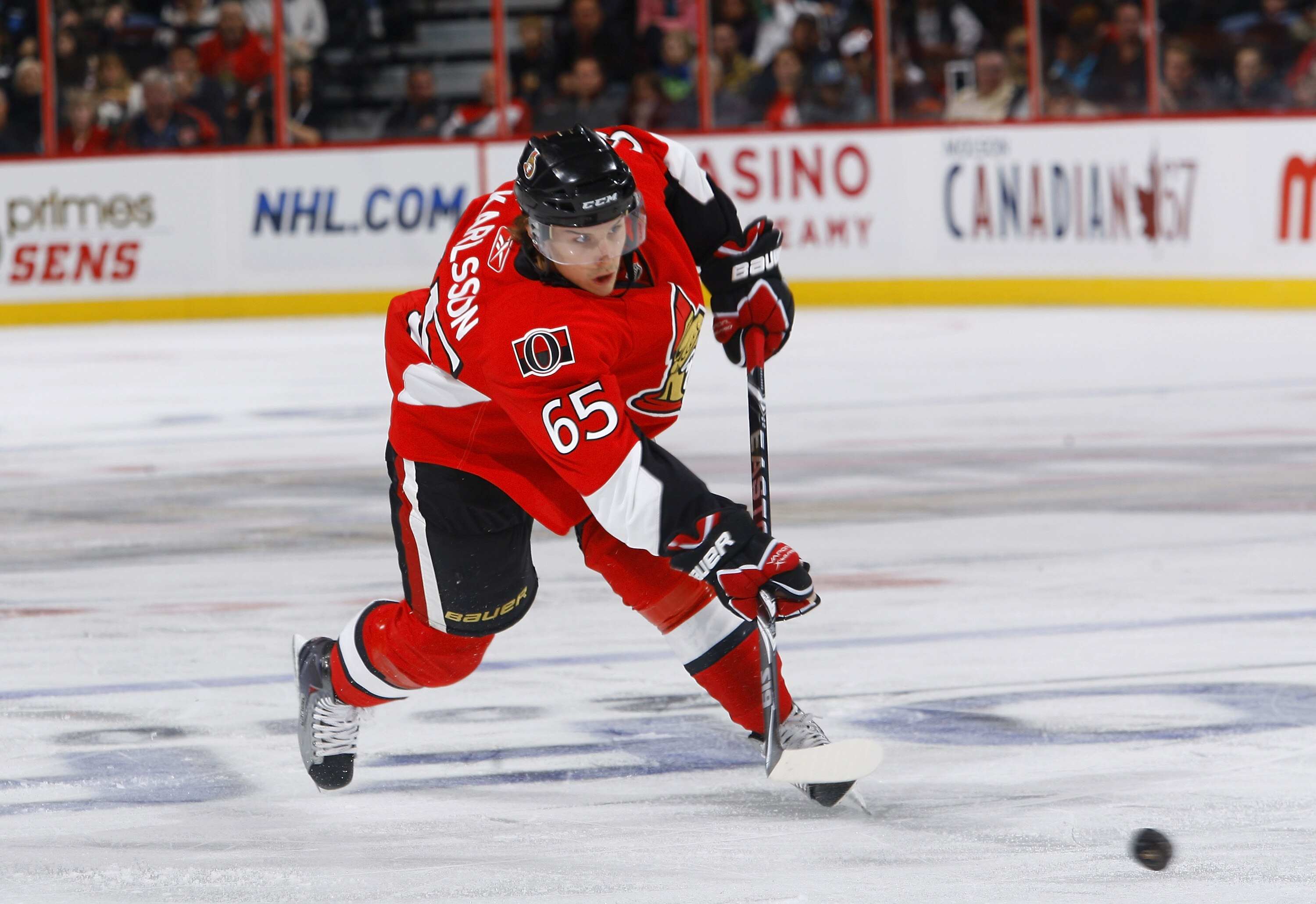 OTTAWA, ON - OCTOBER 14:  Erik Karlsson #65 of the Ottawa Senators shoots the puck down low during a game against the Carolina Hurricanes at Scotiabank Place on October 14, 2010 in Ottawa, Ontario, Canada.  The Ottawa Senators defeated the Carolina Hurric