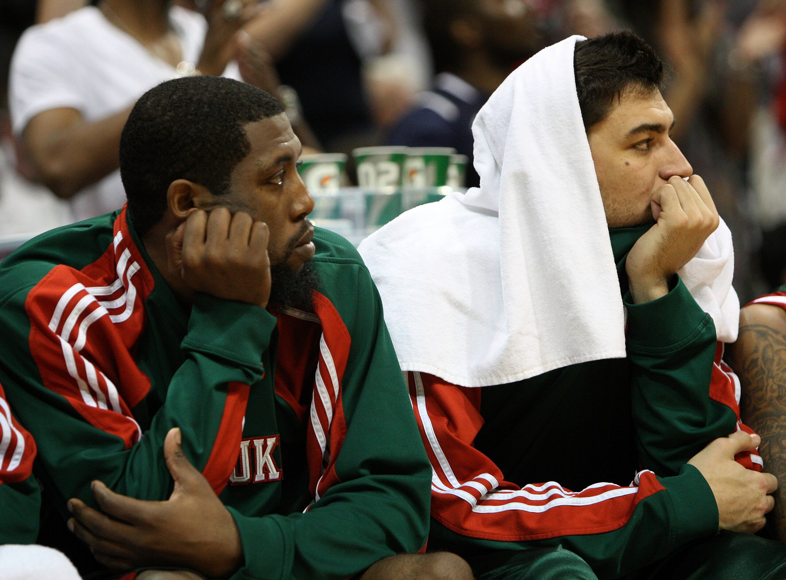 ATLANTA - MAY 2:  Guard John Salmons #15 (L) and Forward Carlos Delfino #10 of the Milwaukee Bucks watch the closing minutes of Game Seven of the Eastern Conference Quarterfinals against the Atlanta Hawks during the 2010 NBA Playoffs at Philips Arena on M