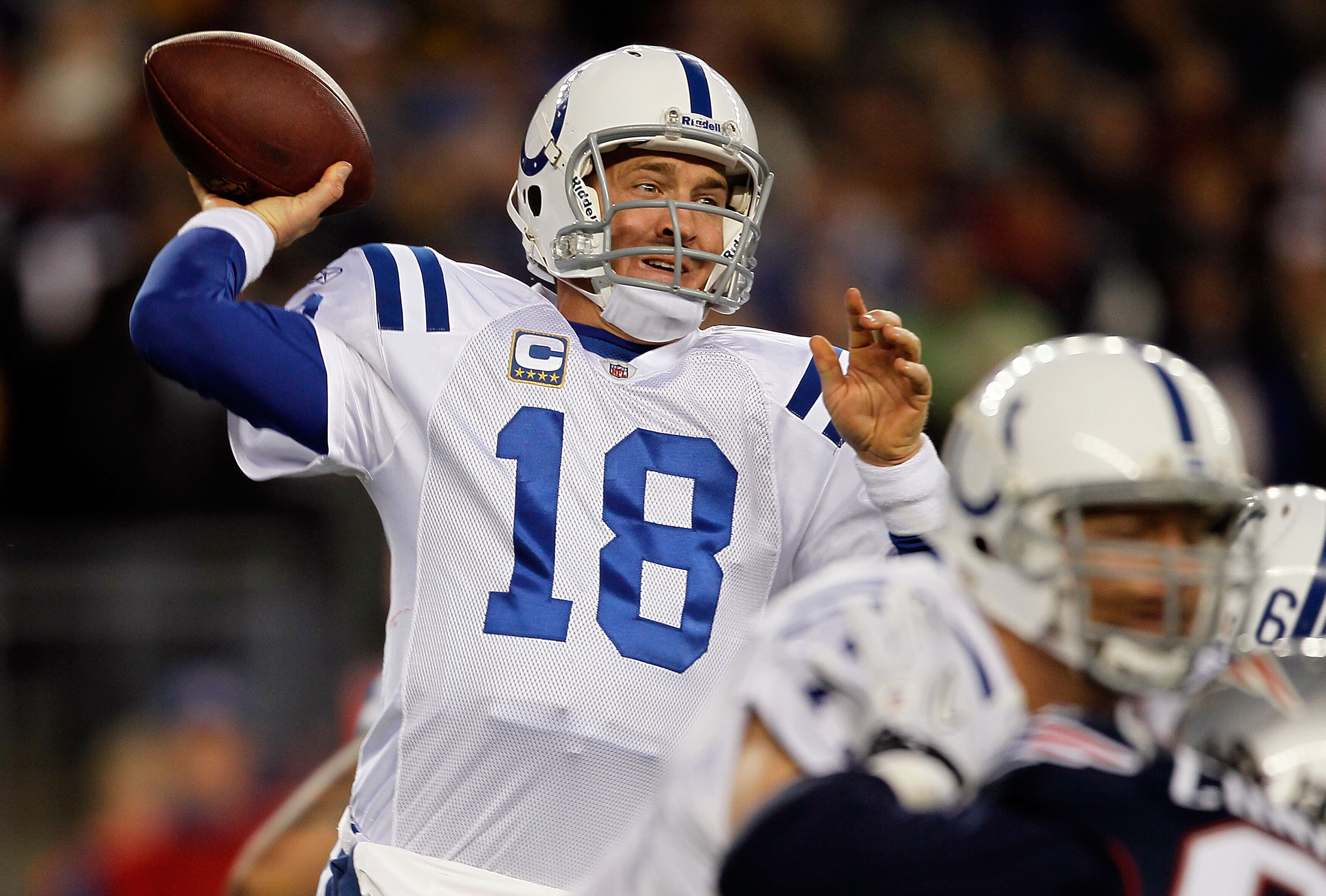 FOXBORO, MA - NOVEMBER 21:  Peyton Manning #18 of the Indianapolis Colts throws against the New England Patriots at Gillette Stadium on November 21, 2010 in Foxboro, Massachusetts. (Photo by Jim Rogash/Getty Images)