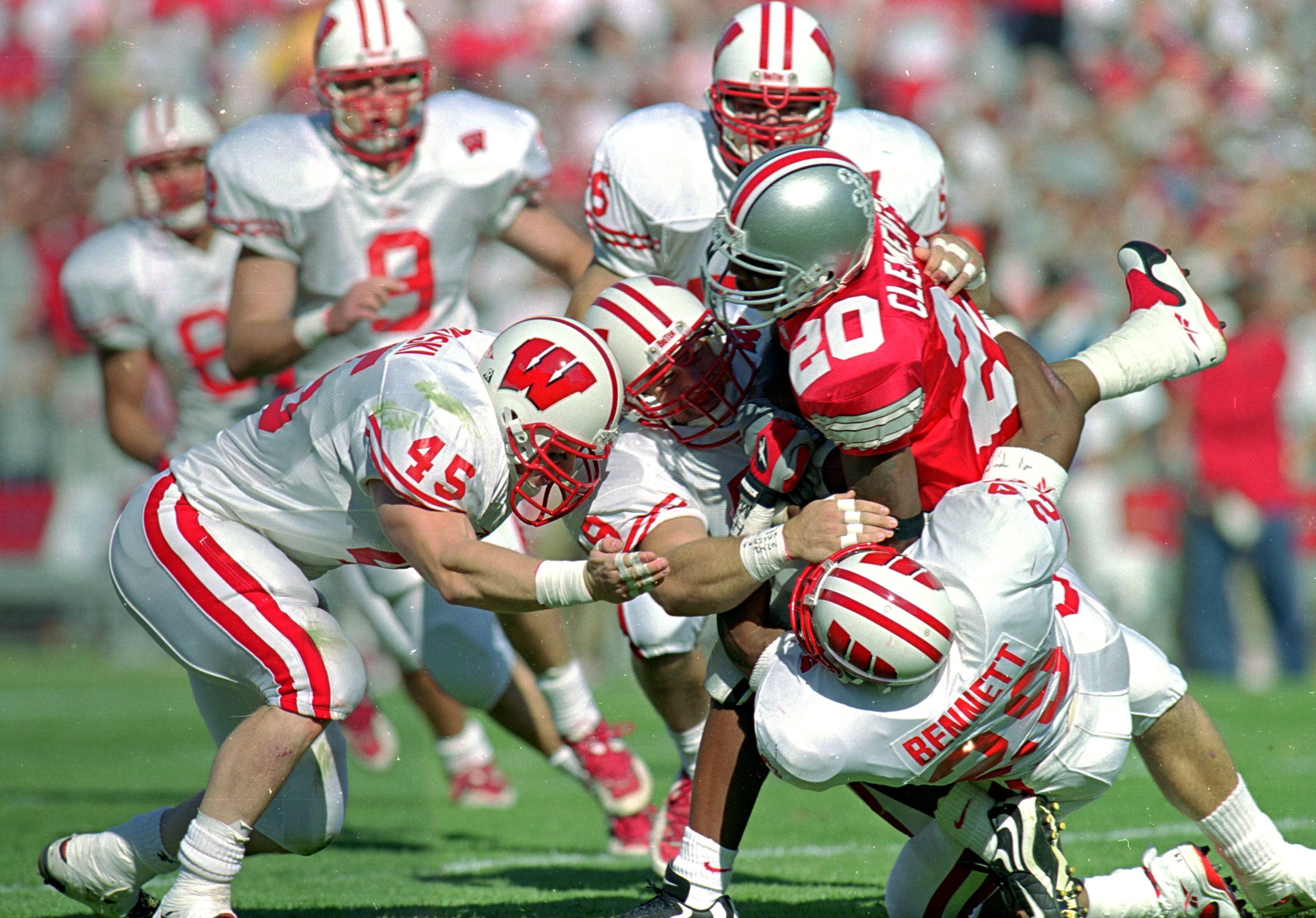 2 Oct 1999:  Nate Clements #20 of the Ohio State Buckeyes is tackled by Michael Bennett #29 of the Wisconsin Badgers at the Ohio Stadium in Columbus, Ohio. The Badgers defeated the Buckeyes 42-17. Mandatory Credit: Mark Lyons  /Allsport