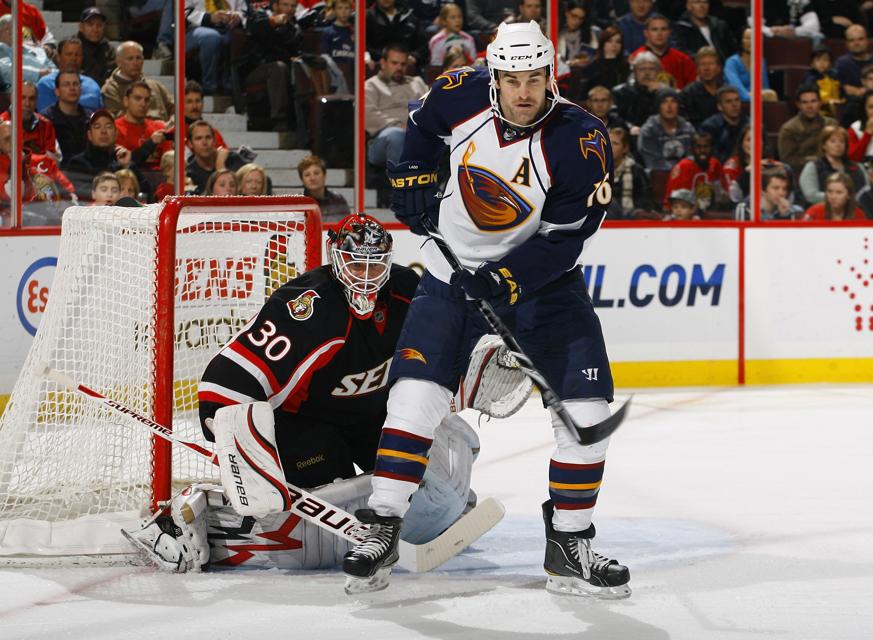 OTTAWA - NOVEMBER 09:  Andrew Ladd #16 of the Atlanta Thrashers screens Brian Elliott #30 of the Ottawa Senators during a game at Scotiabank Place on November 9, 2010 in Ottawa, Ontario, Canada.  The Ottawa Senators defeated the Atlanta Thrashers 5-2. (Ph