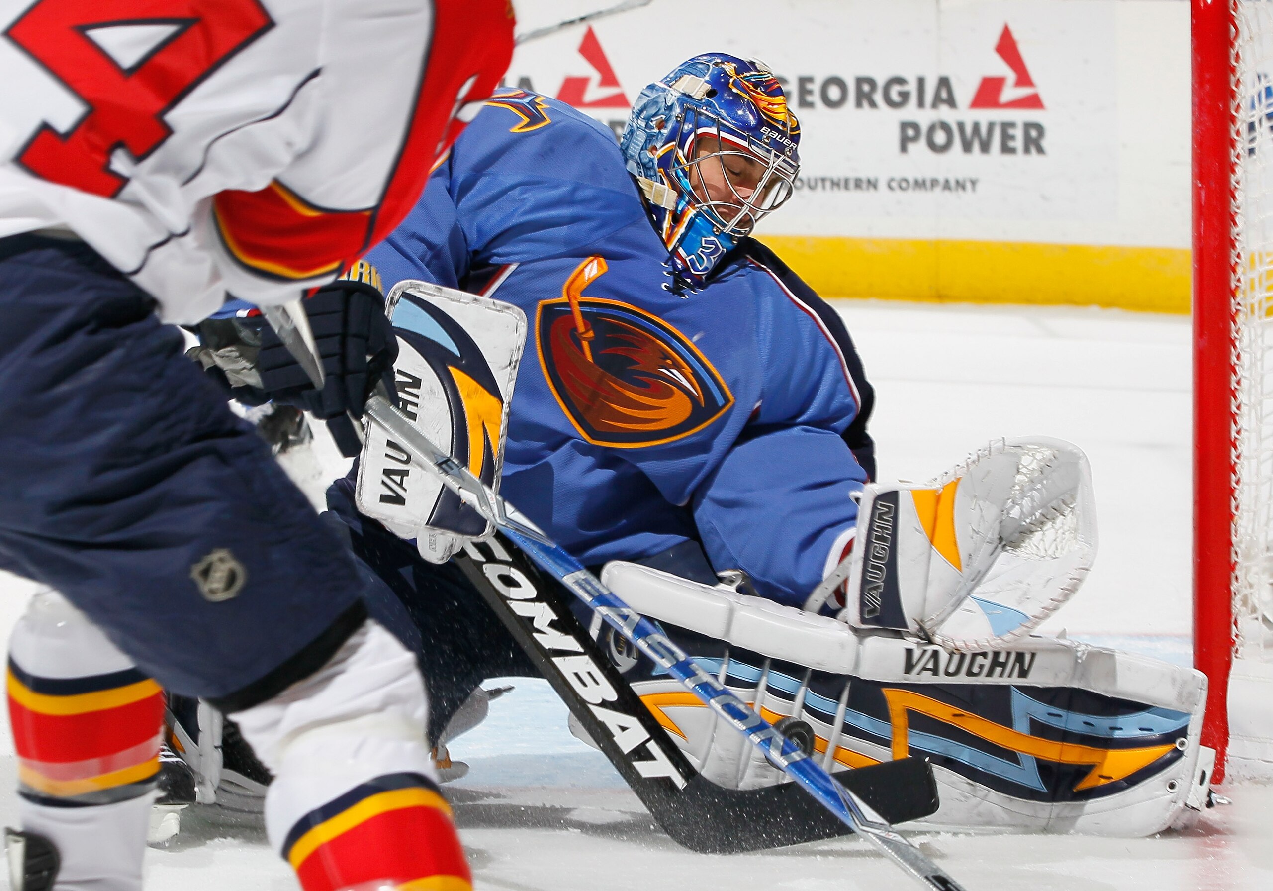 ATLANTA - NOVEMBER 17:  Goaltender Ondrej Pavelec #31 of the Atlanta Thrashers saves a shot on goal by Radek Dvorak #14 of the Florida Panthers at Philips Arena on November 17, 2010 in Atlanta, Georgia.  (Photo by Kevin C. Cox/Getty Images)
