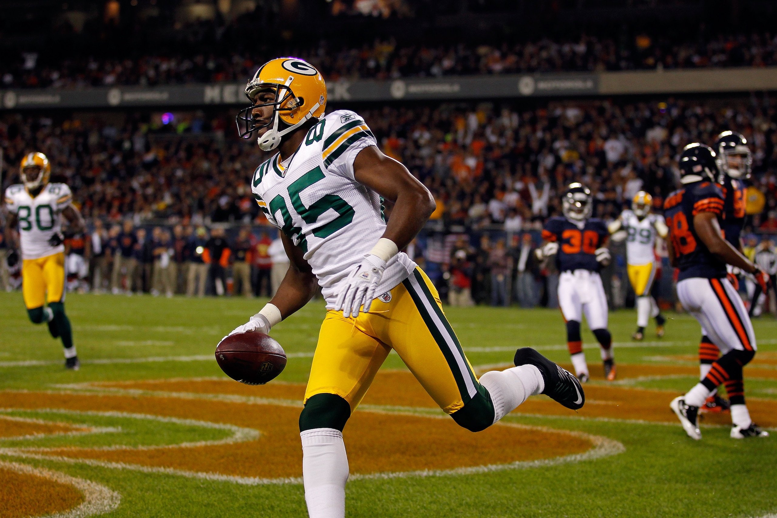 CHICAGO - SEPTEMBER 27:  Greg Jennings #85 of the Green Bay Packers reacts after he scored a 7-yard touchdown reception in the first quarter against the Chicago Bears at Soldier Field on September 27, 2010 in Chicago, Illinois.  (Photo by Jonathan Daniel/