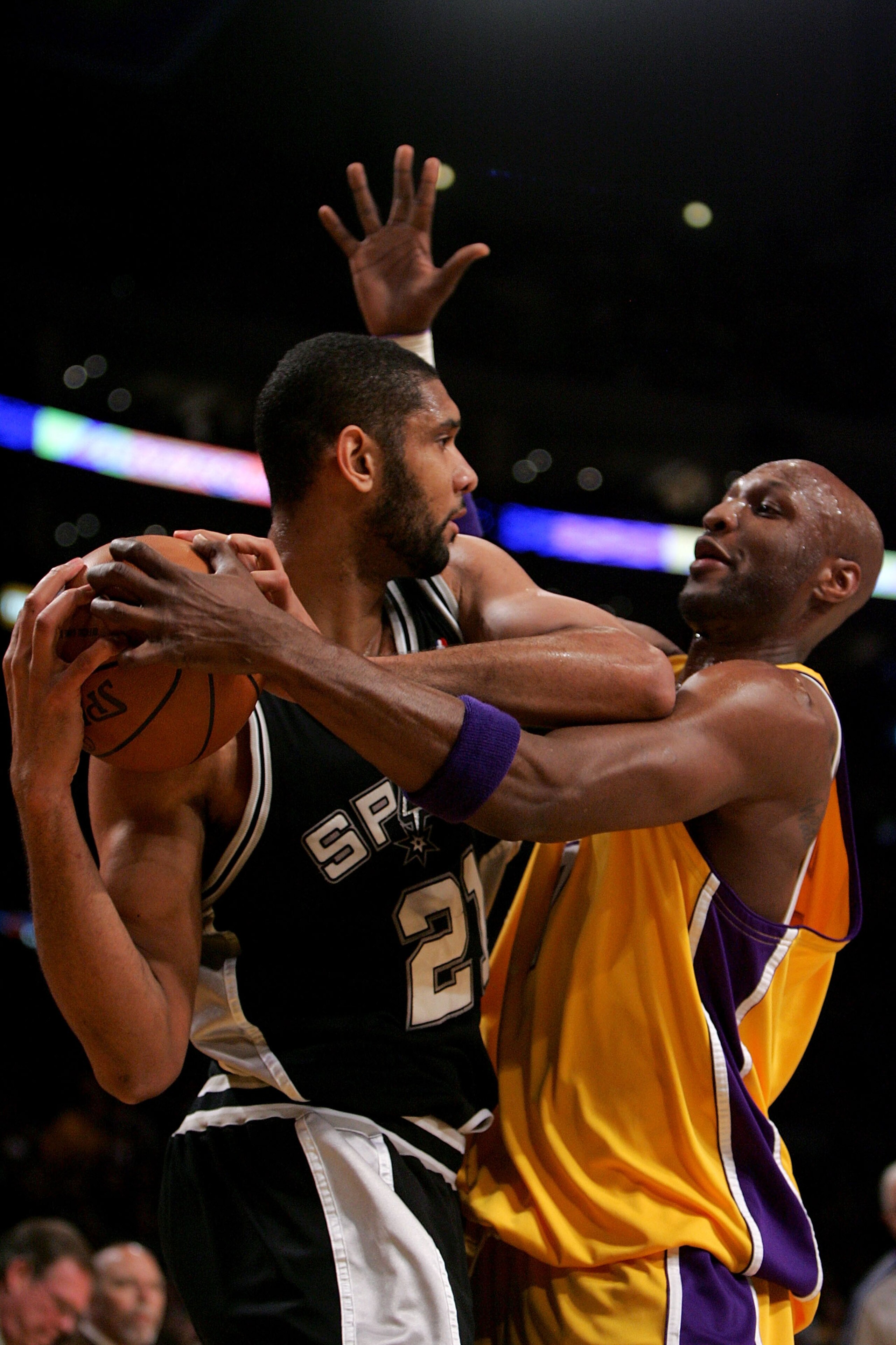 LOS ANGELES, CA - MAY 23: Tim Duncan #21 of the San Antonio Spurs is covered by Lamar Odom #7 of the Los Angeles Lakers in the first quarter of Game Two of the Western Conference Finals during the 2008 NBA Playoffs on May 23, 2008 at Staples Center in Los