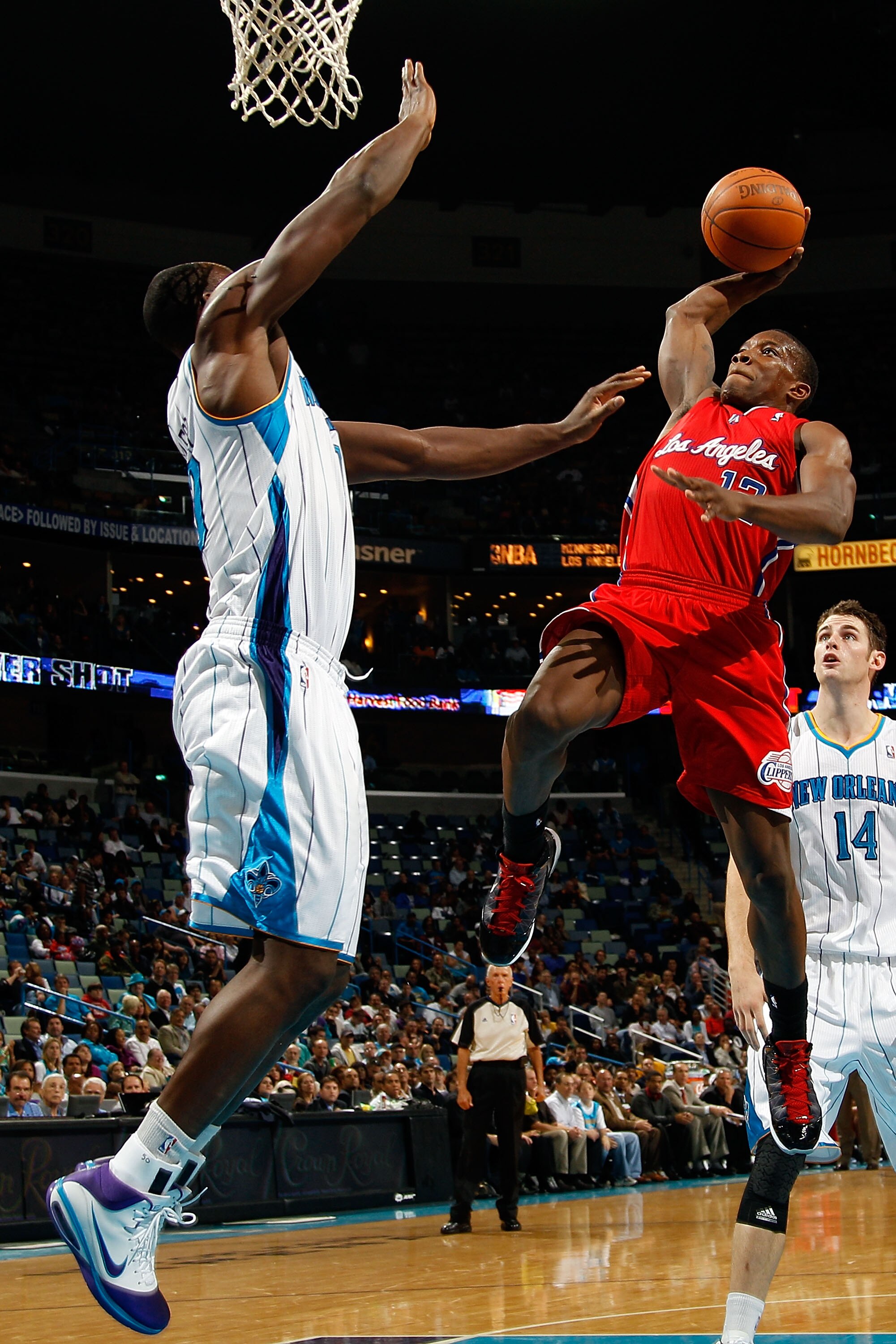 NEW ORLEANS - NOVEMBER 09:  Eric Bledsoe #12 of the Los Angeles Clippers shoots the ball over Emeka Okafor #50 of the New Orleans Hornets at the New Orleans Arena on November 9, 2010 in New Orleans, Louisiana. The Hornets defeated the Clippers 101-82.   N