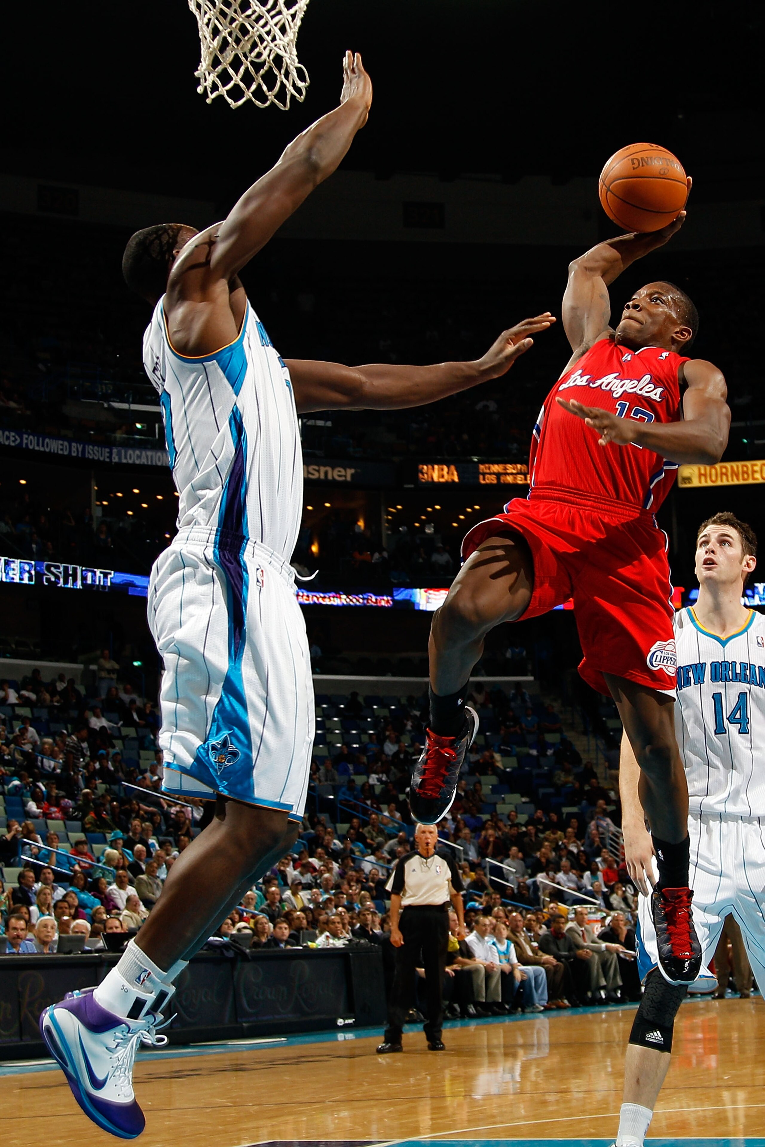 NEW ORLEANS - NOVEMBER 09:  Eric Bledsoe #12 of the Los Angeles Clippers shoots the ball over Emeka Okafor #50 of the New Orleans Hornets at the New Orleans Arena on November 9, 2010 in New Orleans, Louisiana. The Hornets defeated the Clippers 101-82.   N