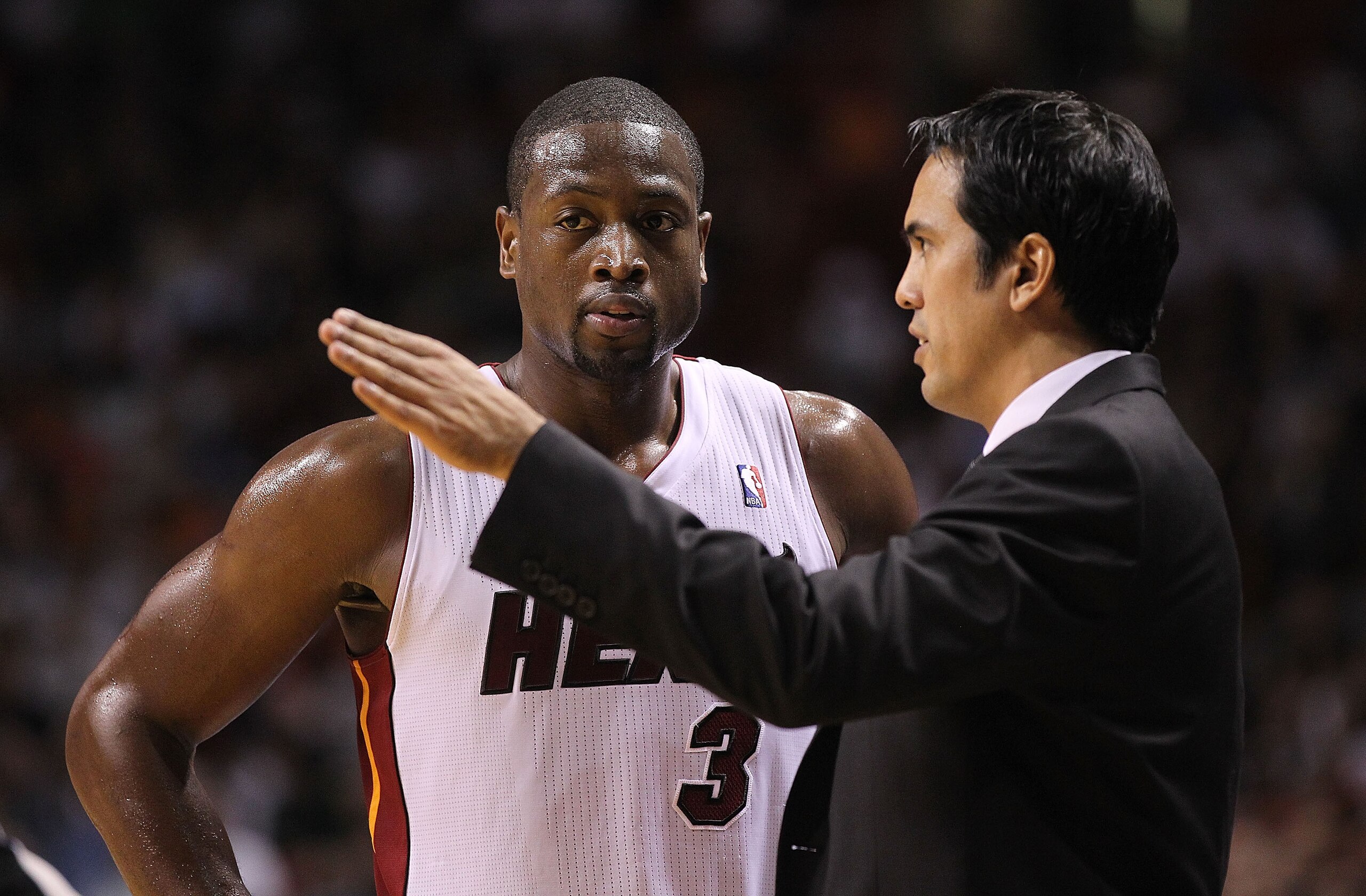 MIAMI - NOVEMBER 17:  Dwyane Wade #3 of the Miami Heat talks with head coach Erik Spoelstra during a game against the Phoenix Suns at American Airlines Arena on November 17, 2010 in Miami, Florida. NOTE TO USER: User expressly acknowledges and agrees that