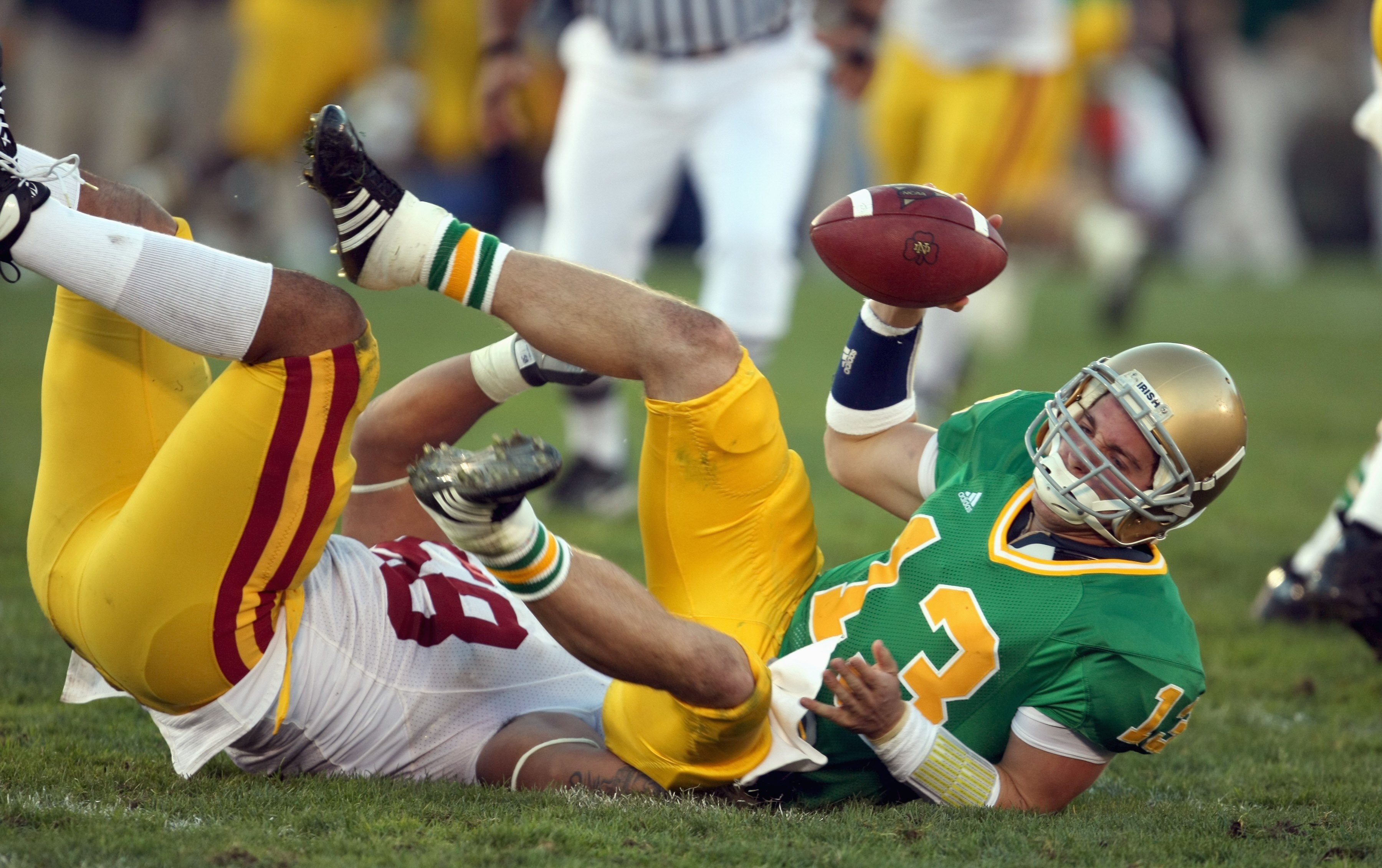 SOUTH BEND, IN - OCTOBER 20: Evan Sharpley #13 of the Notre Dame Fighting Irish is sacked by Rey Maualuga #58 of the University of Southern California Trojans at Notre Dame Stadium October 20, 2007 in South Bend, Indiana. USC defeated Notre Dame 38-0. (Ph