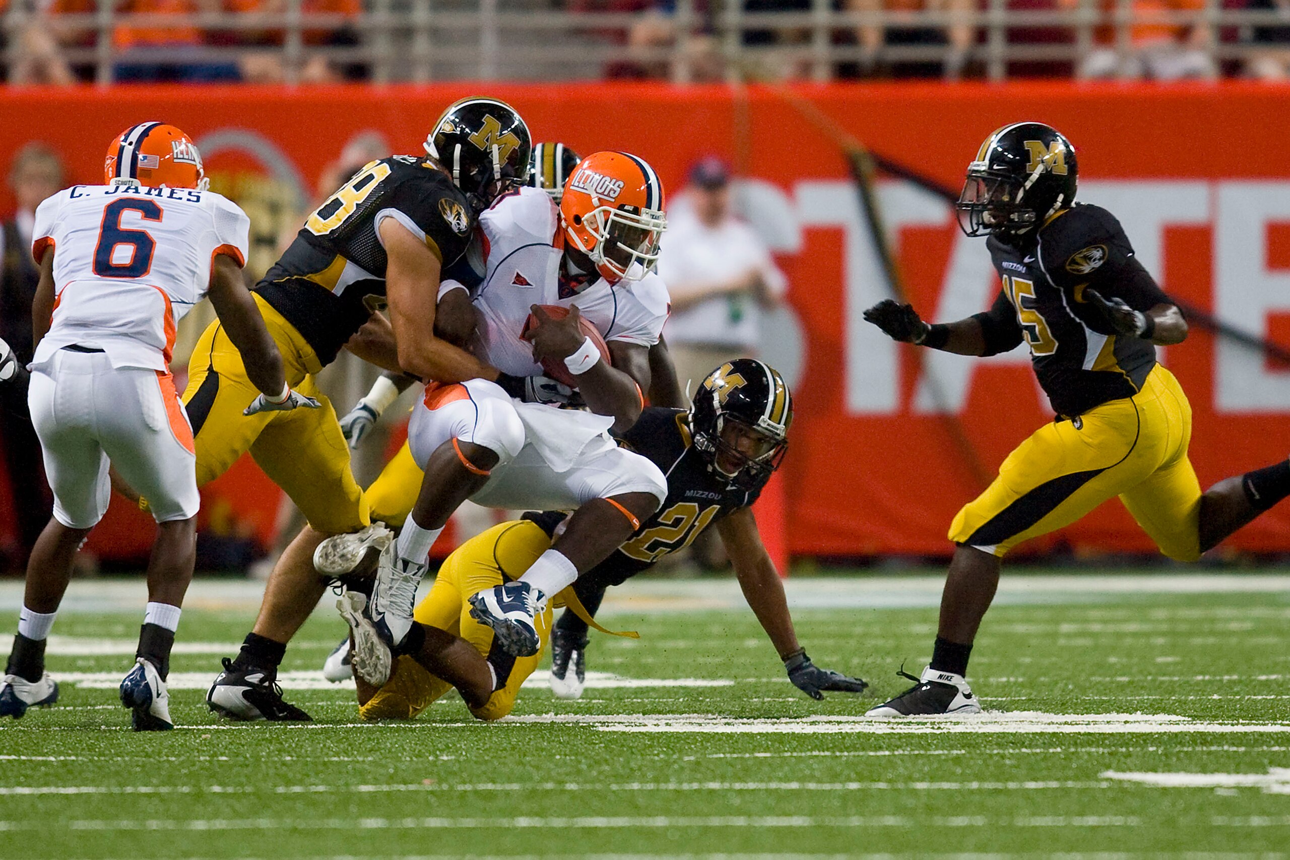 ST. LOUIS, MO - AUGUST 30: Juice Williams #7 of the University of Illinois Fighting Illini is sacked by the University of Missouri Tigers during the State Farm Arch Rivalry game at the Edward Jones Dome on August 30, 2008 in St. Louis, Missouri.  The Tige