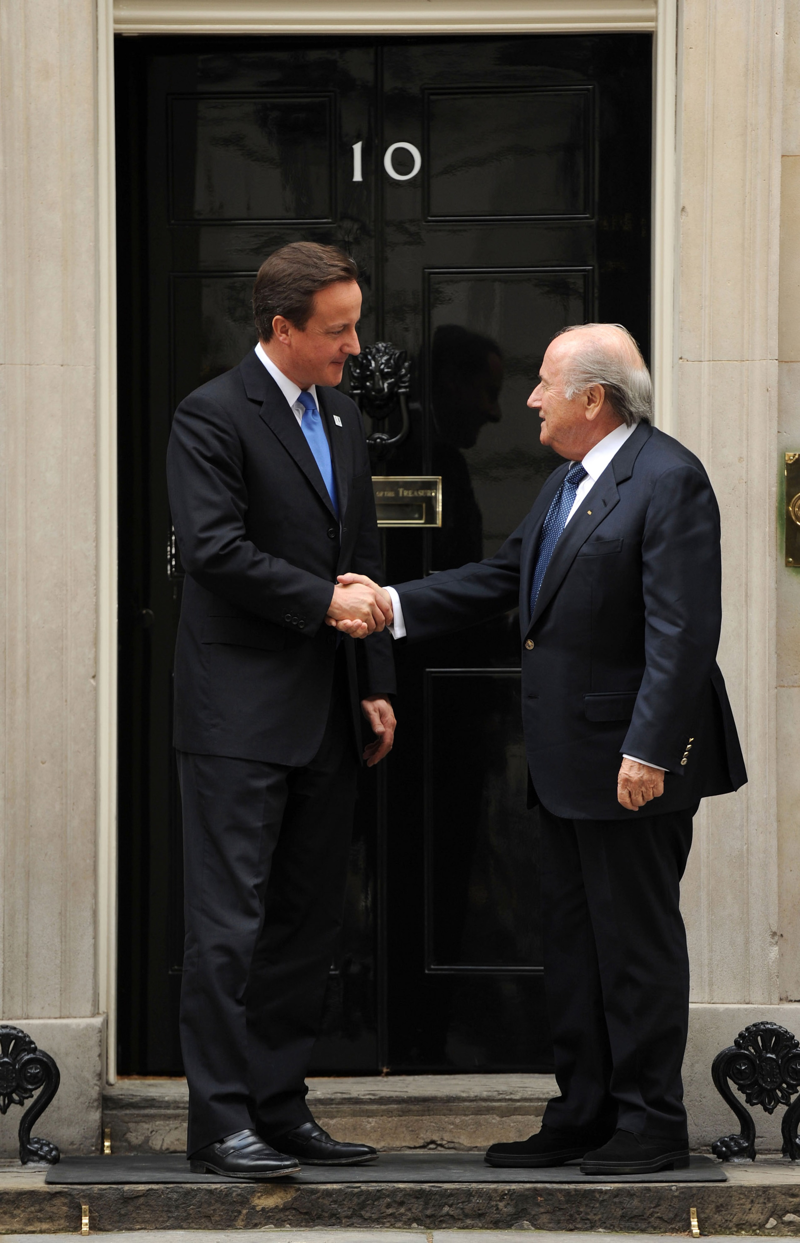 LONDON, ENGLAND - OCTOBER 13:  Prime Minister David Cameron (L) and President of FIFA Sepp Blatter greet each other outside number 10 Downing Street on October 13, 2010 in London, England. Cameron and Baltter discussed England's bid for the 2018 World Cup