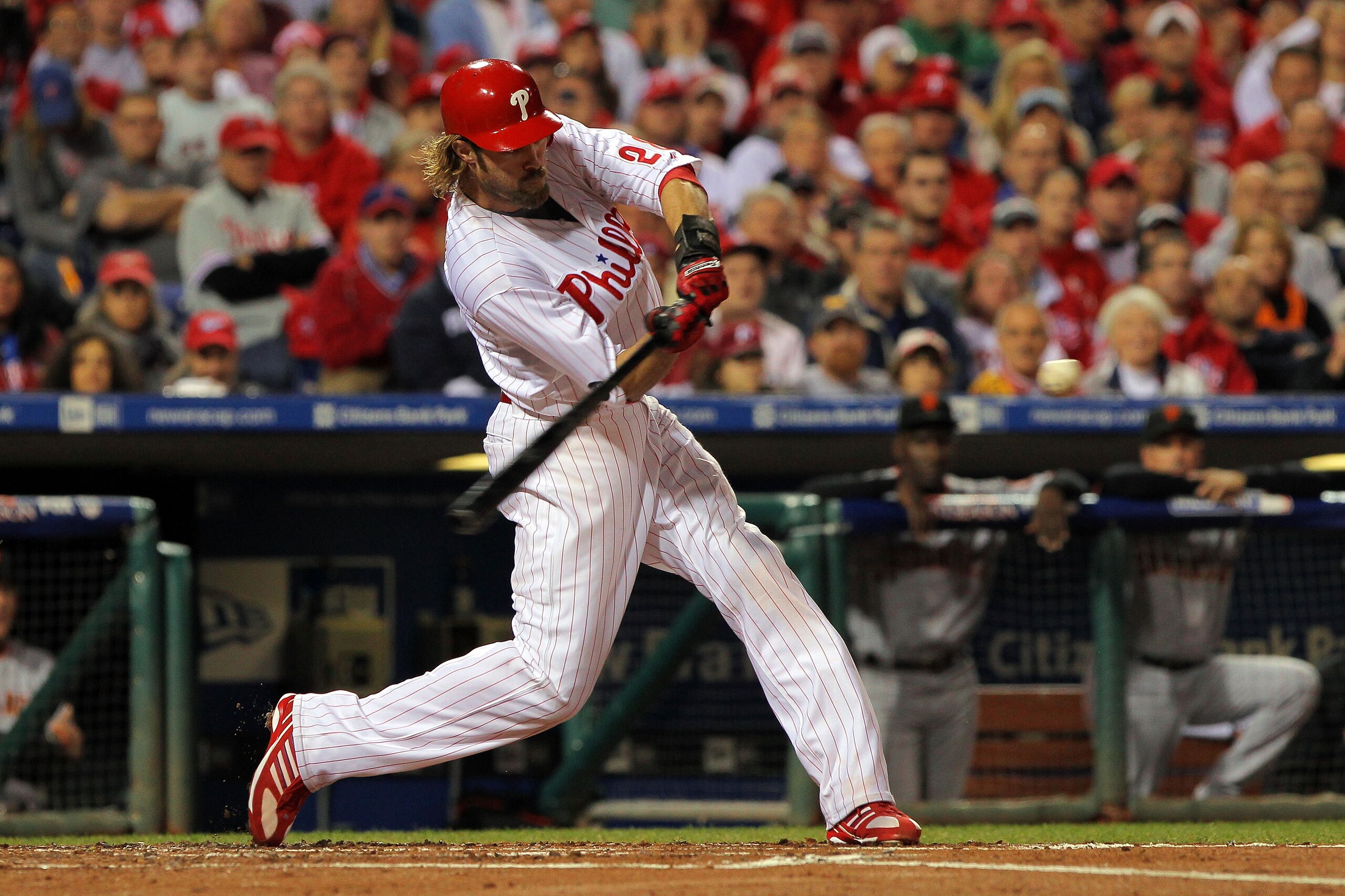 PHILADELPHIA - OCTOBER 23:  Jayson Werth #28 of the Philadelphia Phillies connects for a first inning sacrifice fly against the San Francisco Giants in Game Six of the NLCS during the 2010 MLB Playoffs at Citizens Bank Park on October 23, 2010 in Philadel