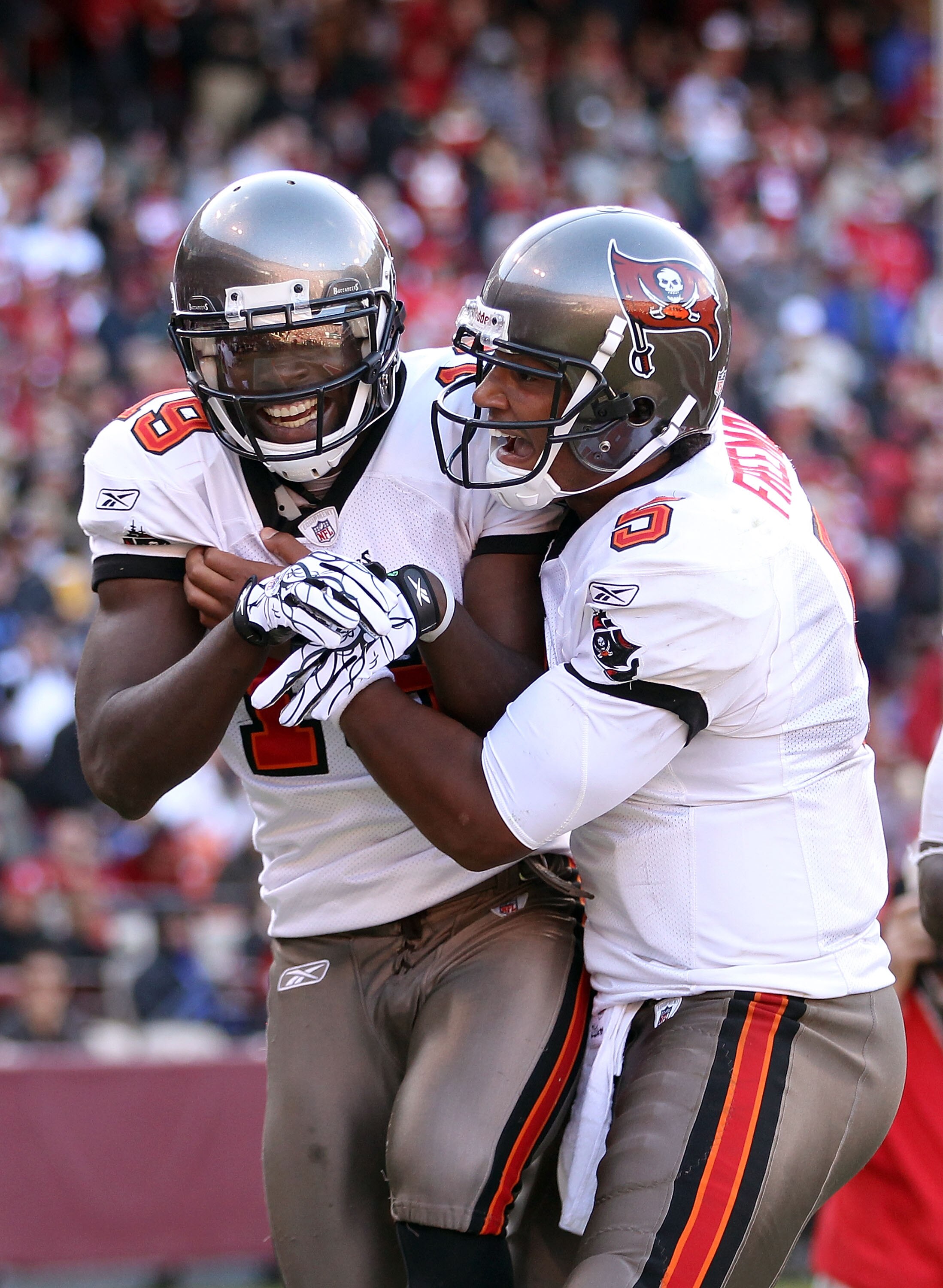 SAN FRANCISCO - NOVEMBER 21:  Mike Williams #19 of the Tampa Bay Buccaneers is congratulated by Josh Freeman #5 after he scored a touchdown against the San Francisco 49ers at Candlestick Park on November 21, 2010 in San Francisco, California.  (Photo by E