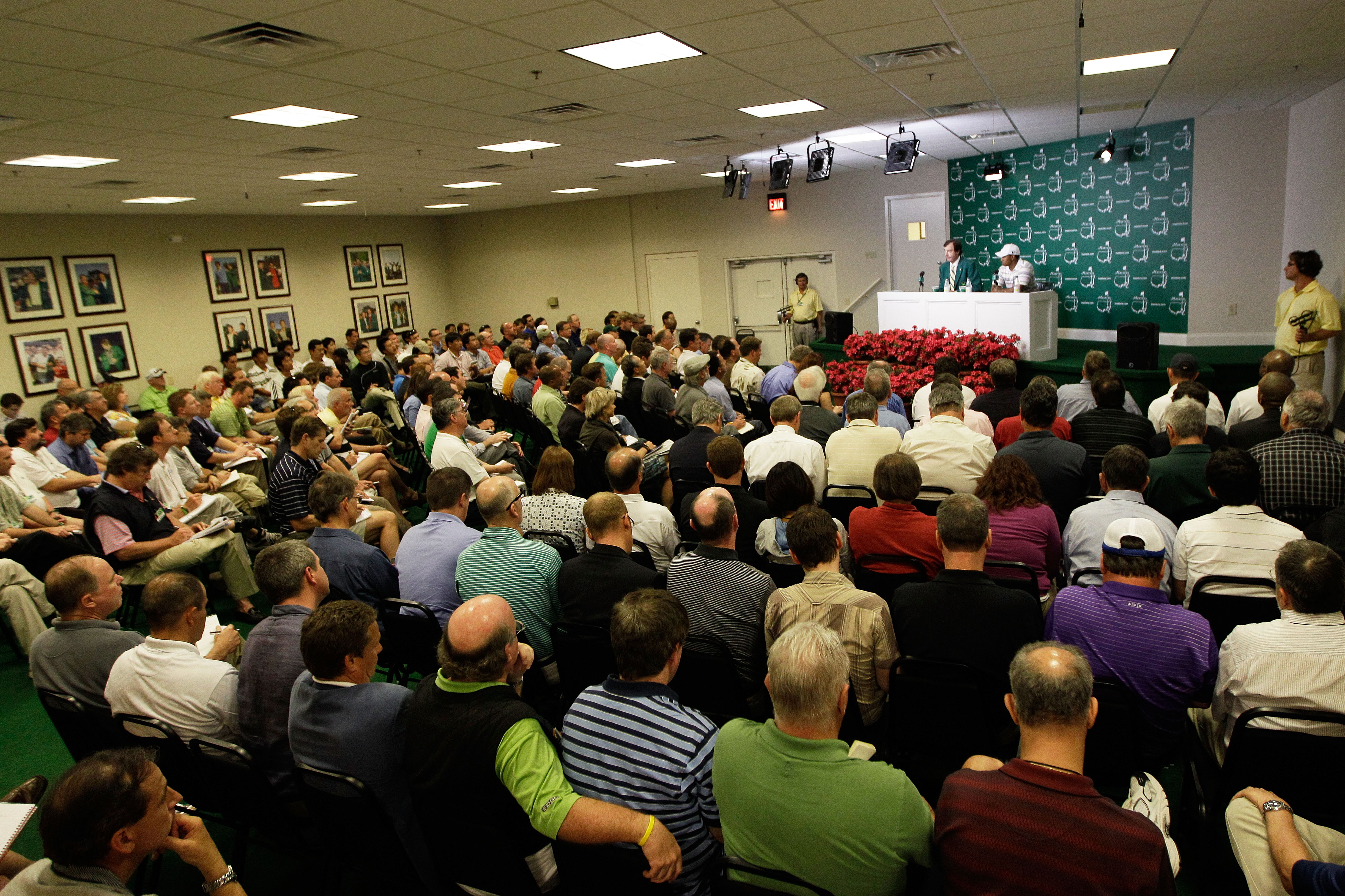 AUGUSTA, GA - APRIL 05:  (L-R) Craig Heatley, Chairman of The Masters Media Committee, sits alongside Tiger Woods as he addresses members of the media during a press conference prior to the 2010 Masters Tournament at Augusta National Golf Club on April 5,