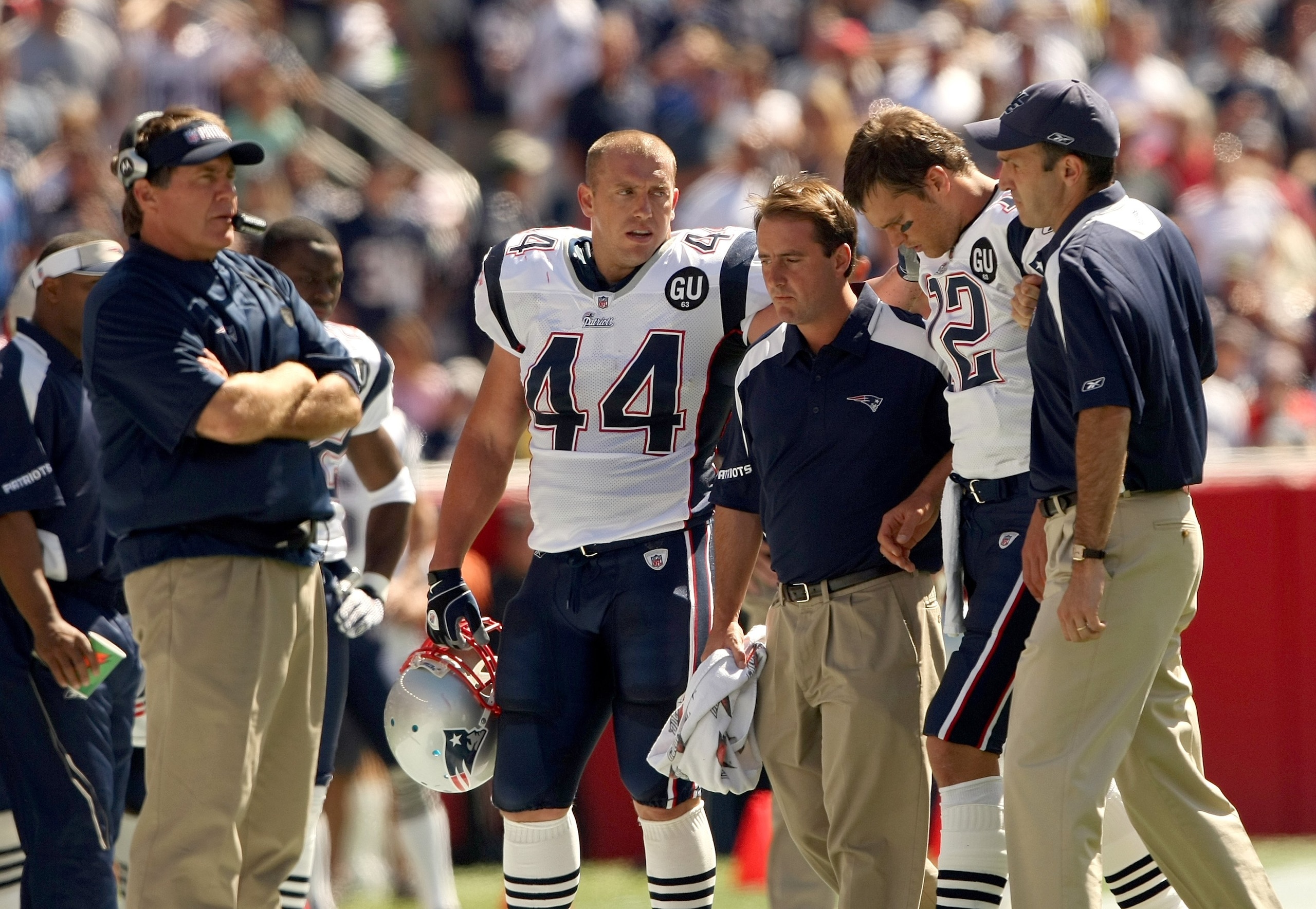 FOXBORO, MA - SEPTEMBER 7: Quarterback Tom Brady #12 of the New England Patriots walks off the field with the aid of the Patriots staff after being injured on a play as Head Coach Bill Belichick looks on from the sideline during their NFL game against th FOXBORO, MA - SEPTEMBER 7: Quarterback Tom Brady #12 of the New England Patriots walks off the field with the aid of the Patriots staff after being injured on a play as Head Coach Bill Belichick looks on from the sideline during their NFL game against th