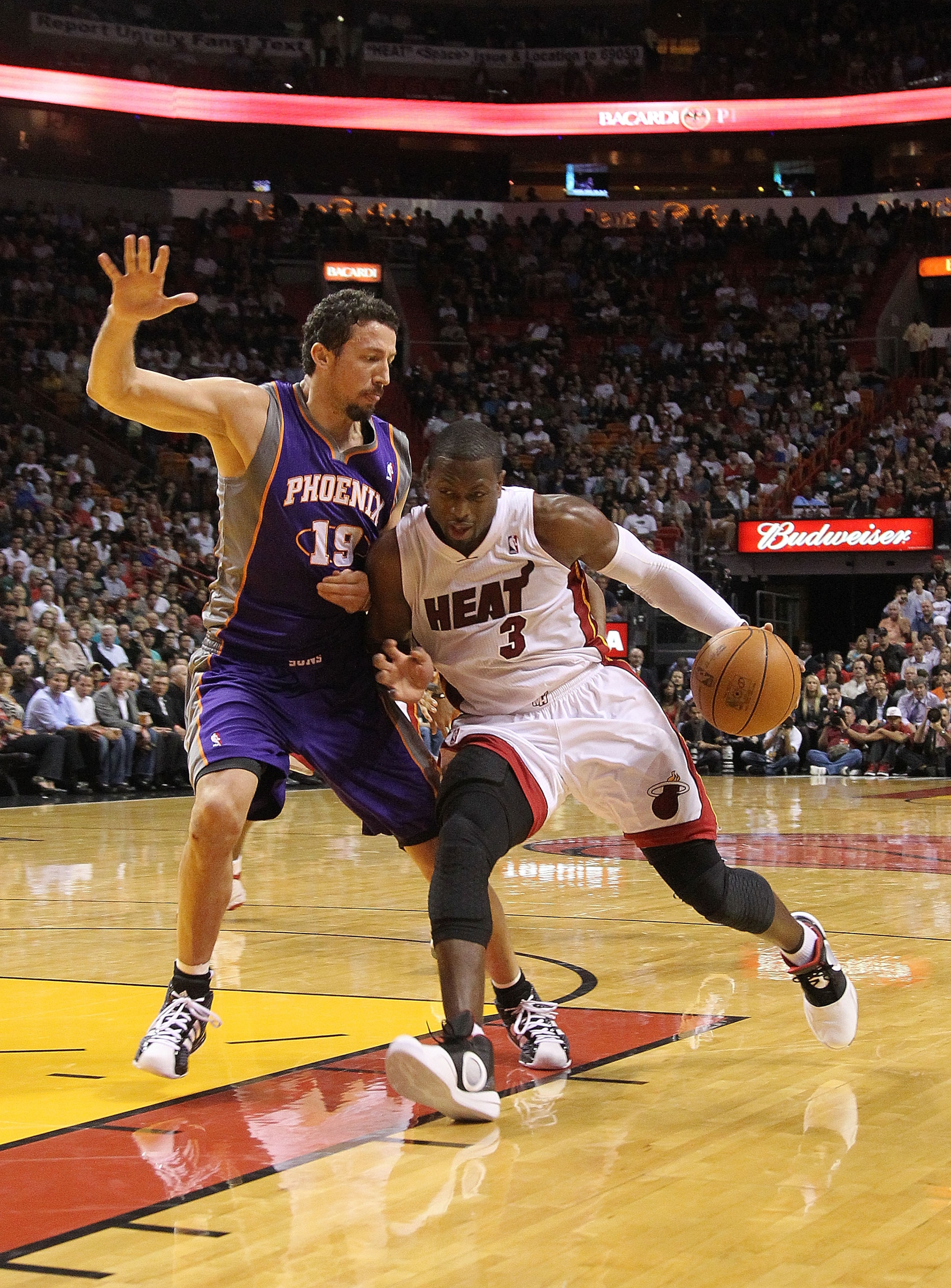 MIAMI - NOVEMBER 17:  Dwyane Wade #3 of the Miami Heat drives against Hedo Turkoglu #19  during a game against the Phoenix Suns at American Airlines Arena on November 17, 2010 in Miami, Florida. NOTE TO USER: User expressly acknowledges and agrees that, b